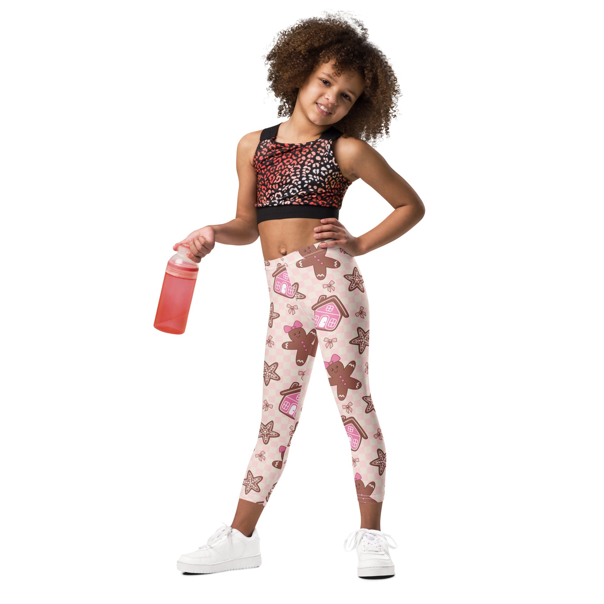 Girls pink gingerbread christmas buttery soft leggings with playful gingerbread houses stars and cookies pattern