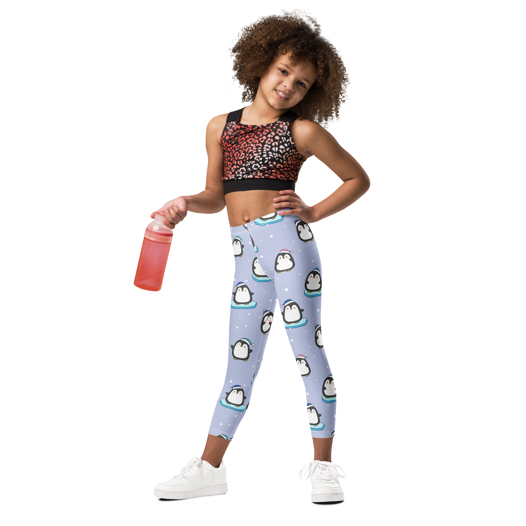 Light blue girls winter penguin christmas buttery soft leggings with playful cartoon penguins on icebergs pattern