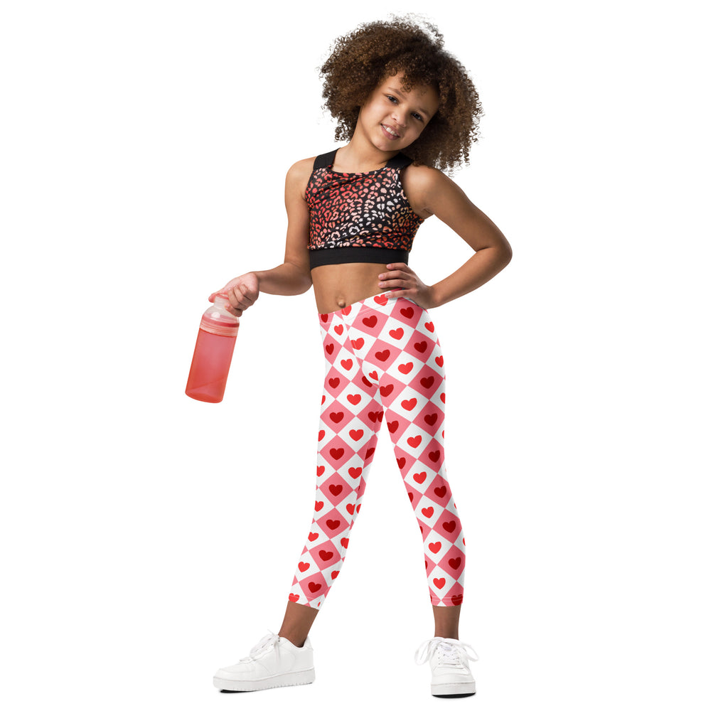 Girls pink argyle heart leggings in red and white diamond grid pattern made of buttery soft fabric