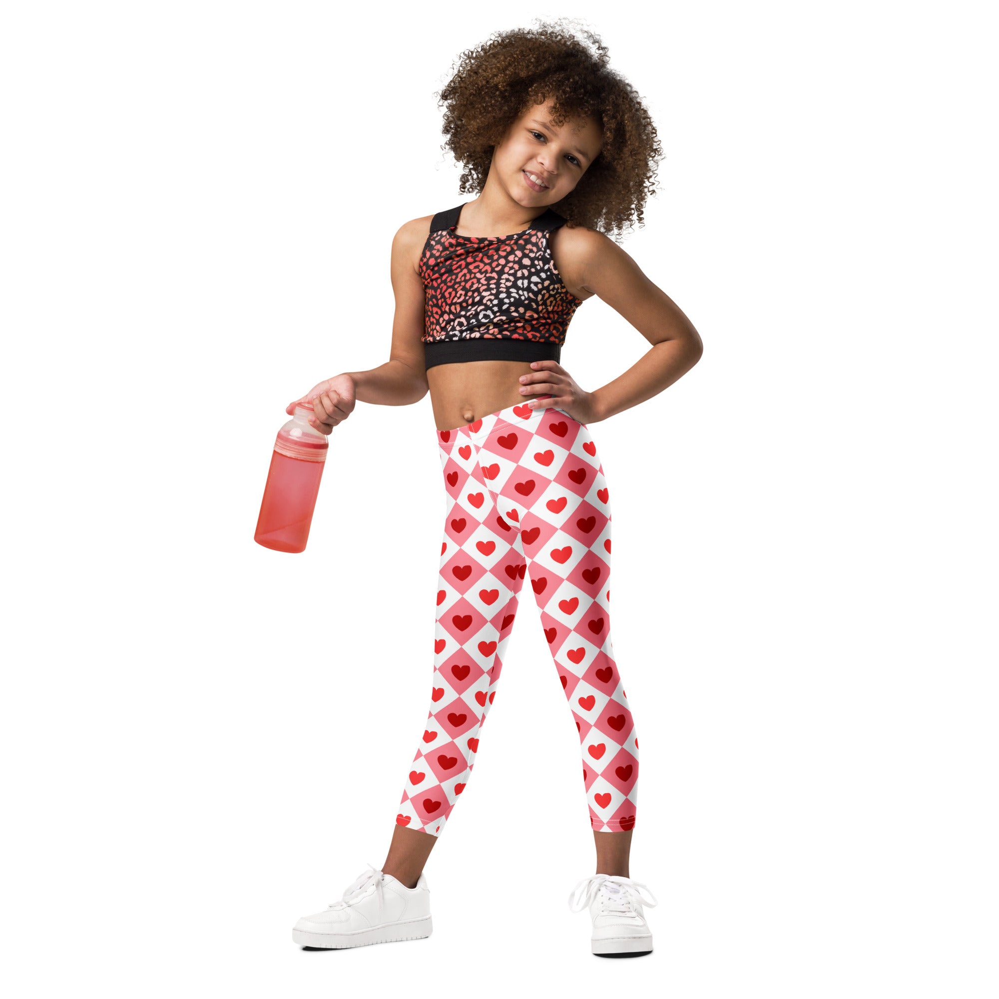 Girls pink argyle heart leggings in red and white diamond grid pattern made of buttery soft fabric
