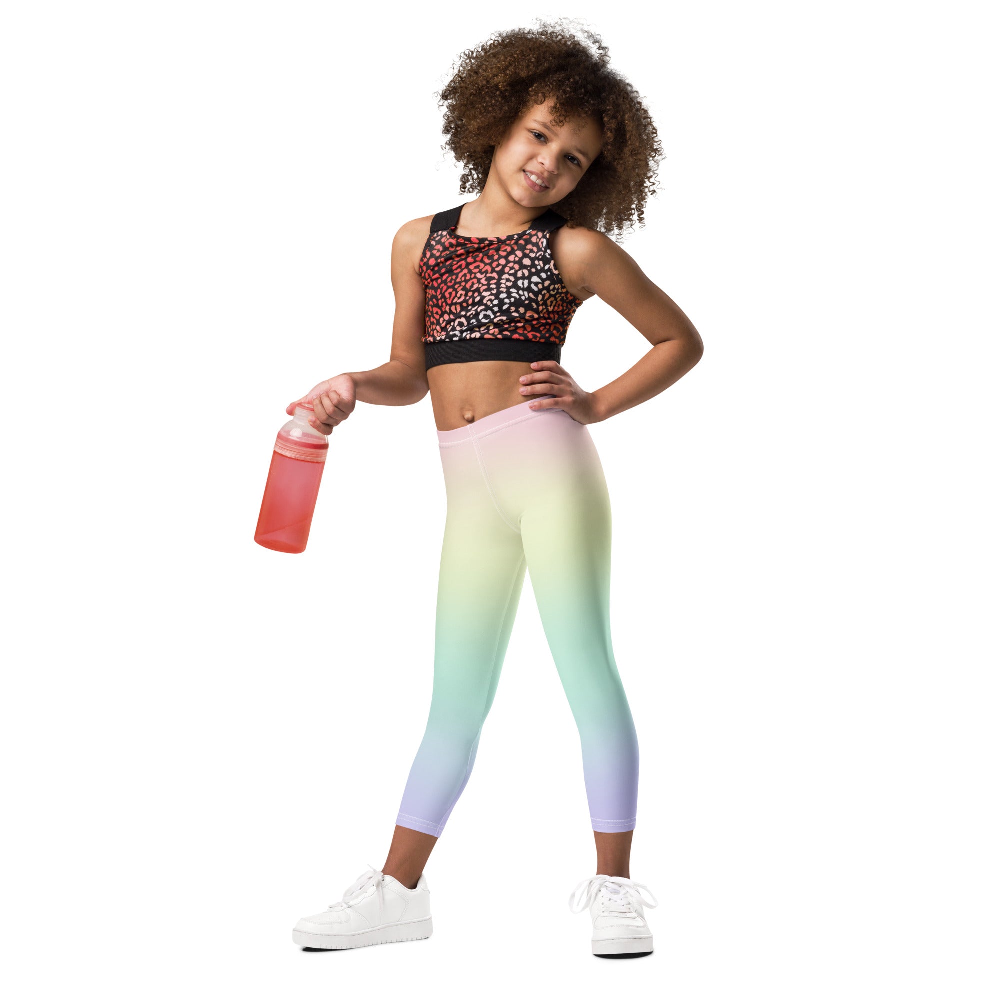 Girls pastel rainbow buttery soft leggings paired with a leopard print crop top showcasing vibrant colors and comfort
