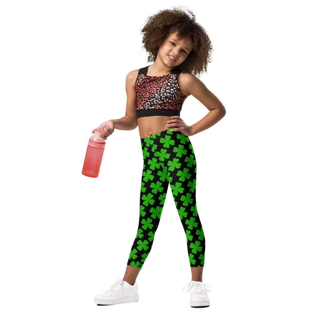 Girls black and green shamrock buttery soft leggings featuring green four-leaf clover pattern on black fabric