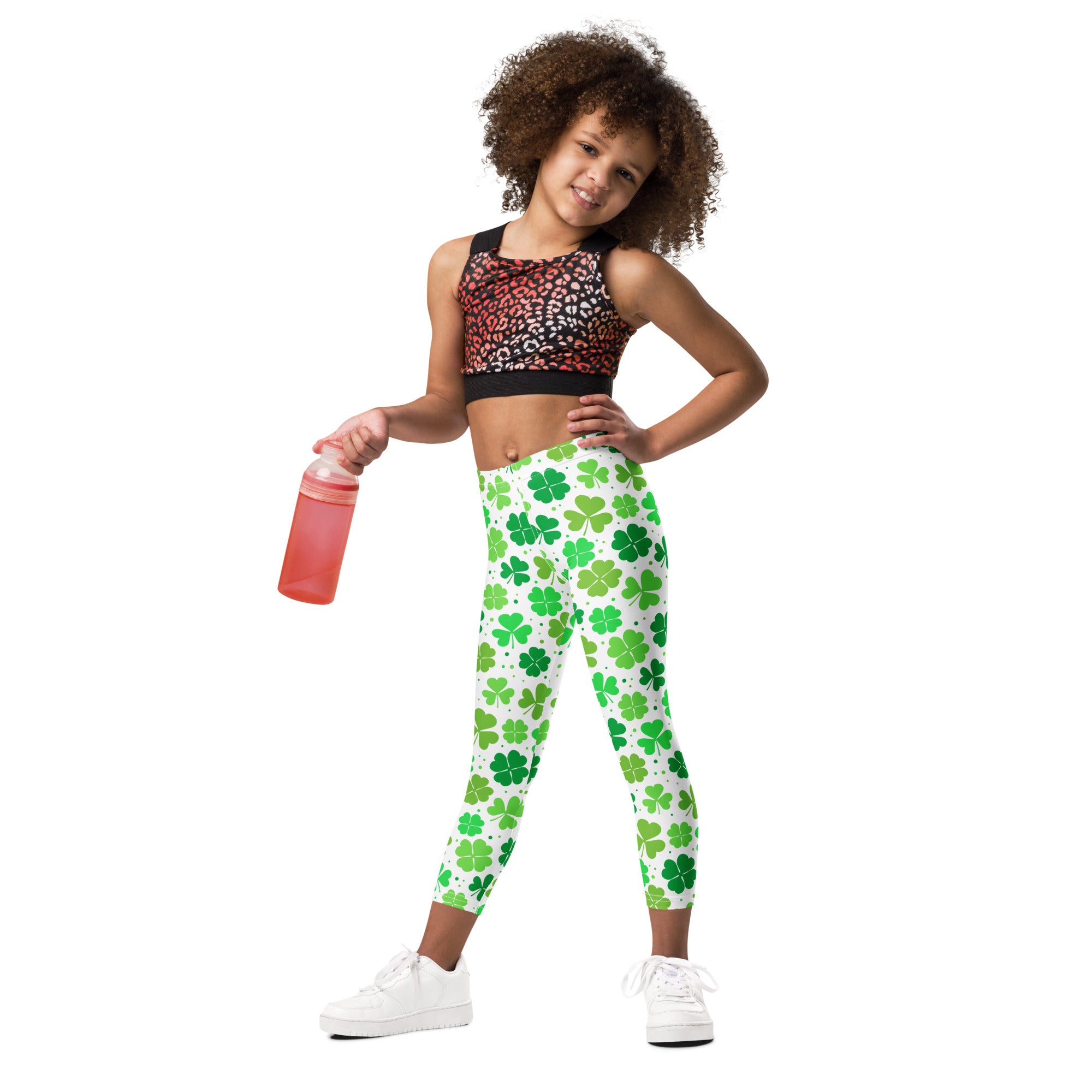 Girls lucky shamrock buttery soft leggings in white with a vibrant green shamrock pattern for festive wear