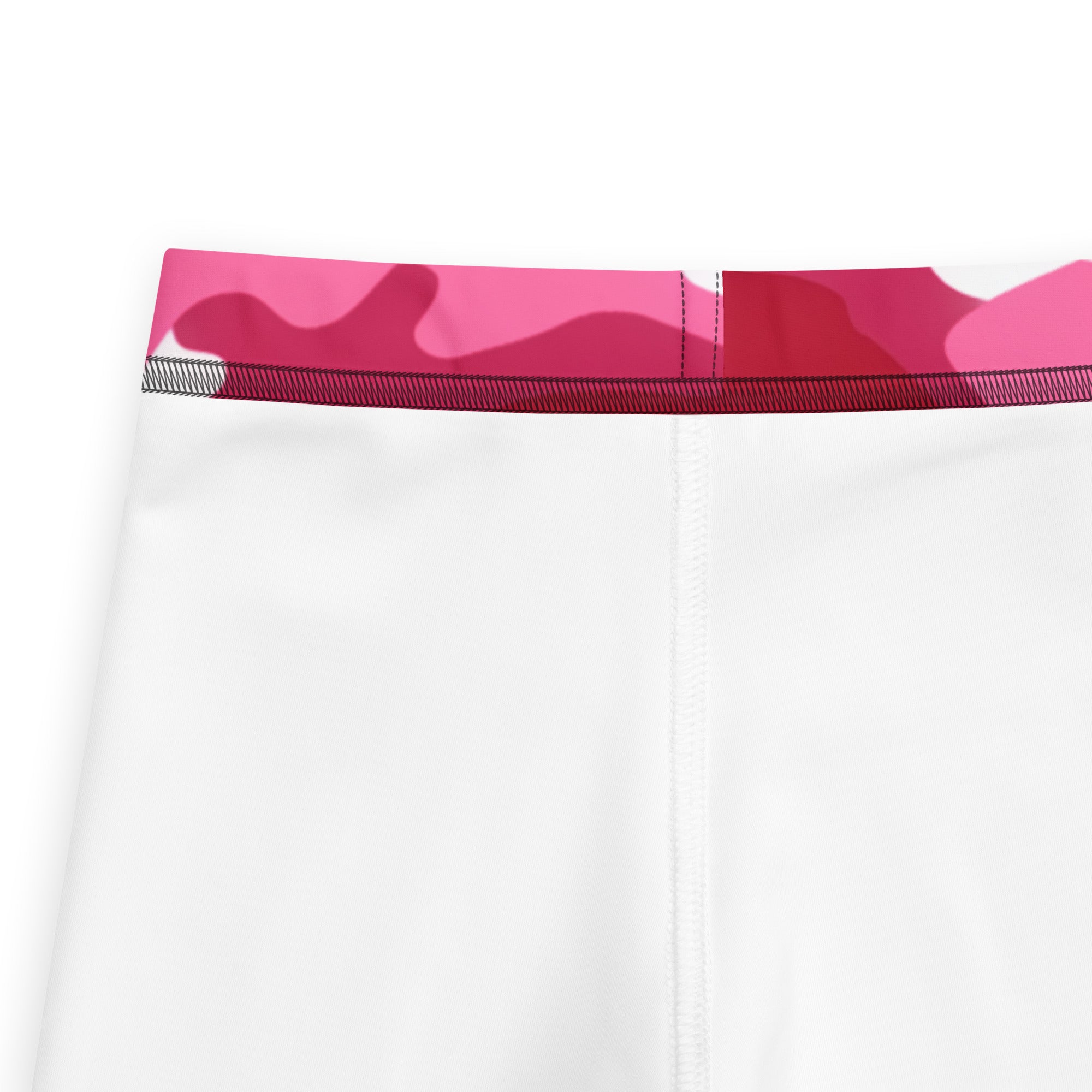 Girls pink camouflage buttery soft leggings featuring white athletic leggings with a vibrant pink camouflage waistband