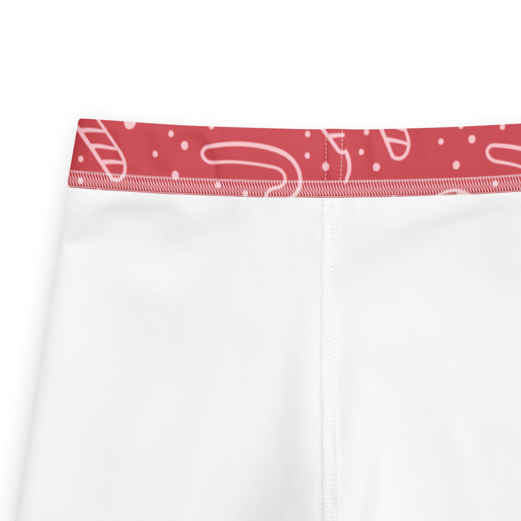 Girls red candy cane buttery soft leggings in white with a red waistband and candy cane dot patterns