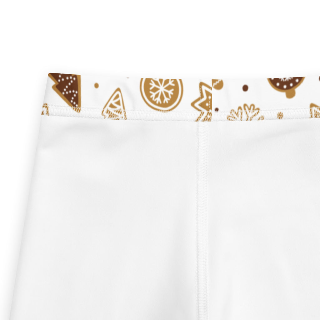 Kids gingerbread christmas leggings in white buttery soft fabric with a festive brown and gold holiday waistband