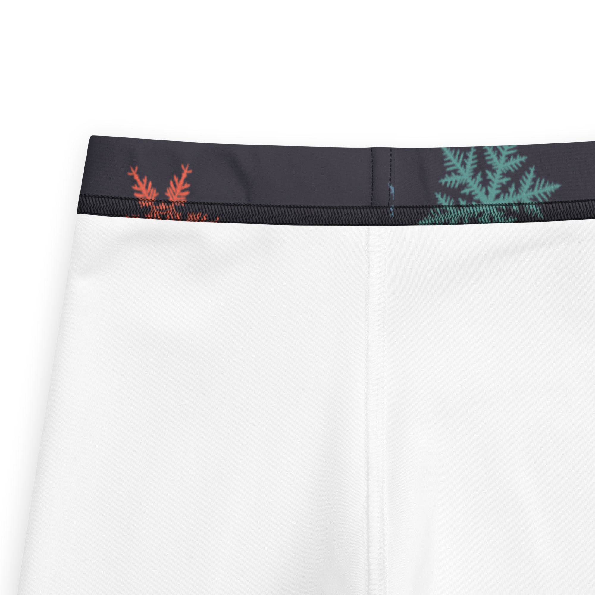 White athletic leggings with black waistband and orange teal leaf patterns festive kids christmas leggings