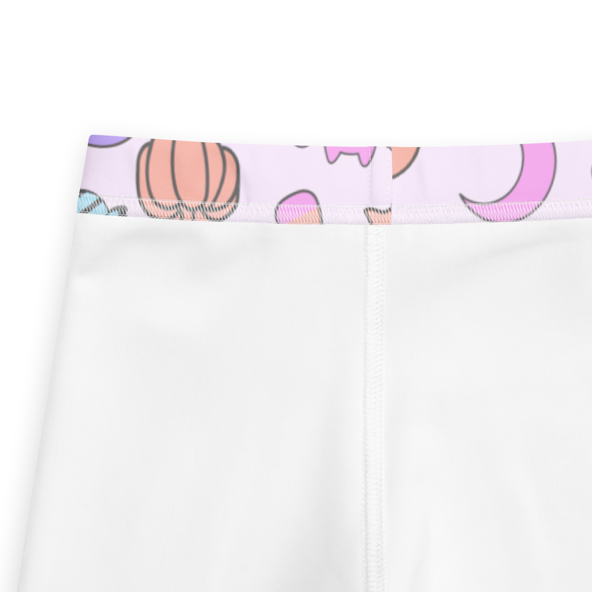 Girls halloween pattern buttery soft white leggings with a pastel waistband featuring cartoon pumpkins and moons