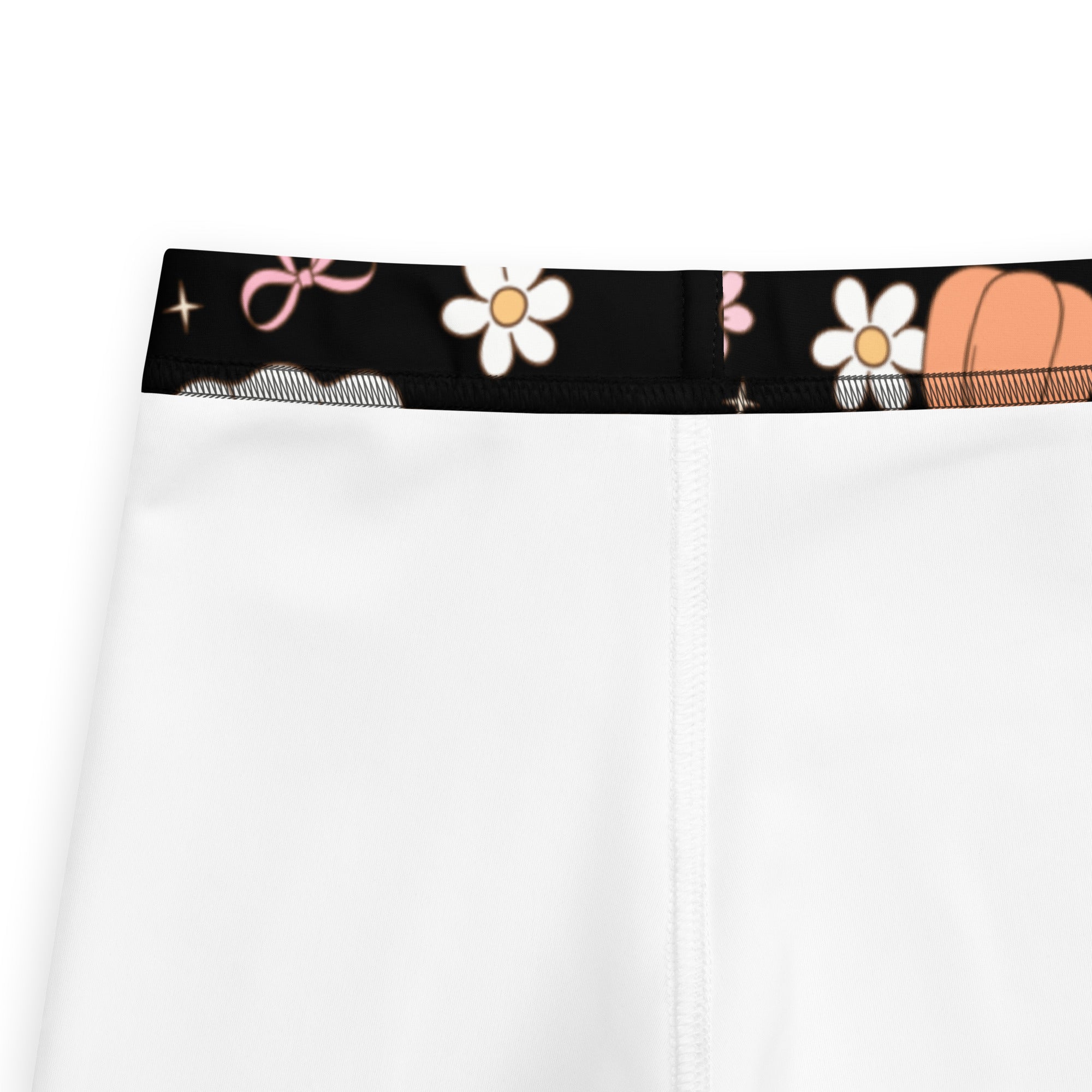 Girls reading ghosts white leggings with black waistband and playful daisy pink bow and orange pumpkin pattern buttery soft