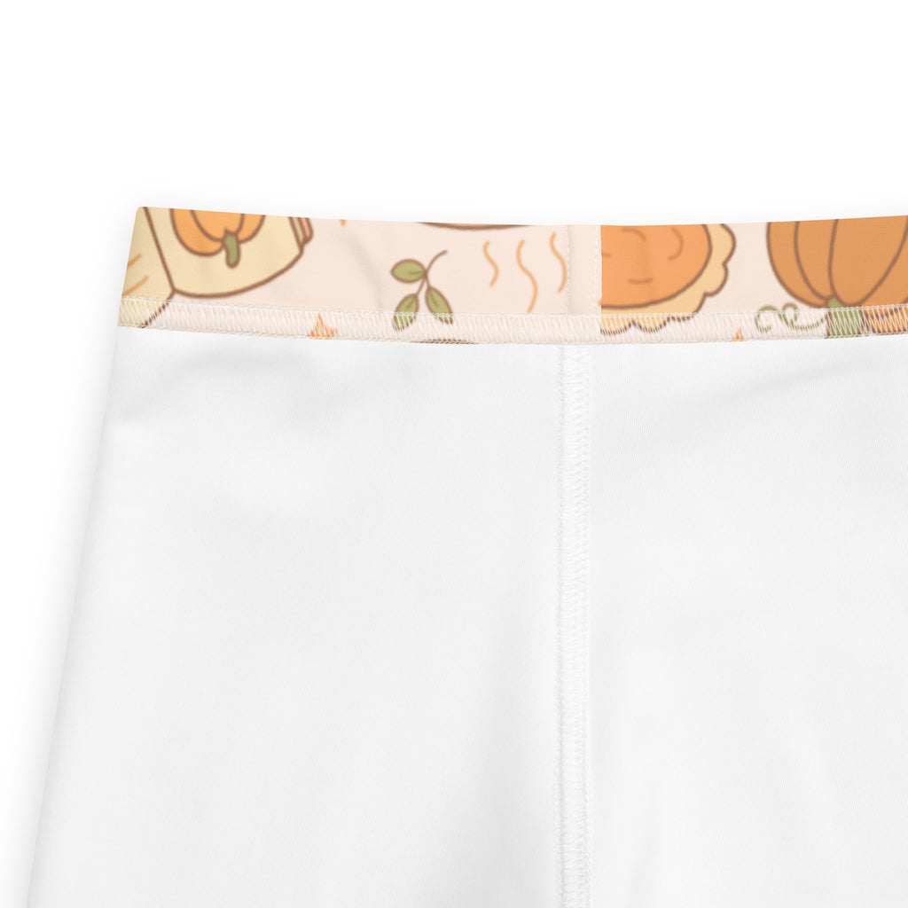 Kids pumpkin pie themed buttery soft white leggings with decorative waistband featuring cartoon pumpkins and autumn leaves