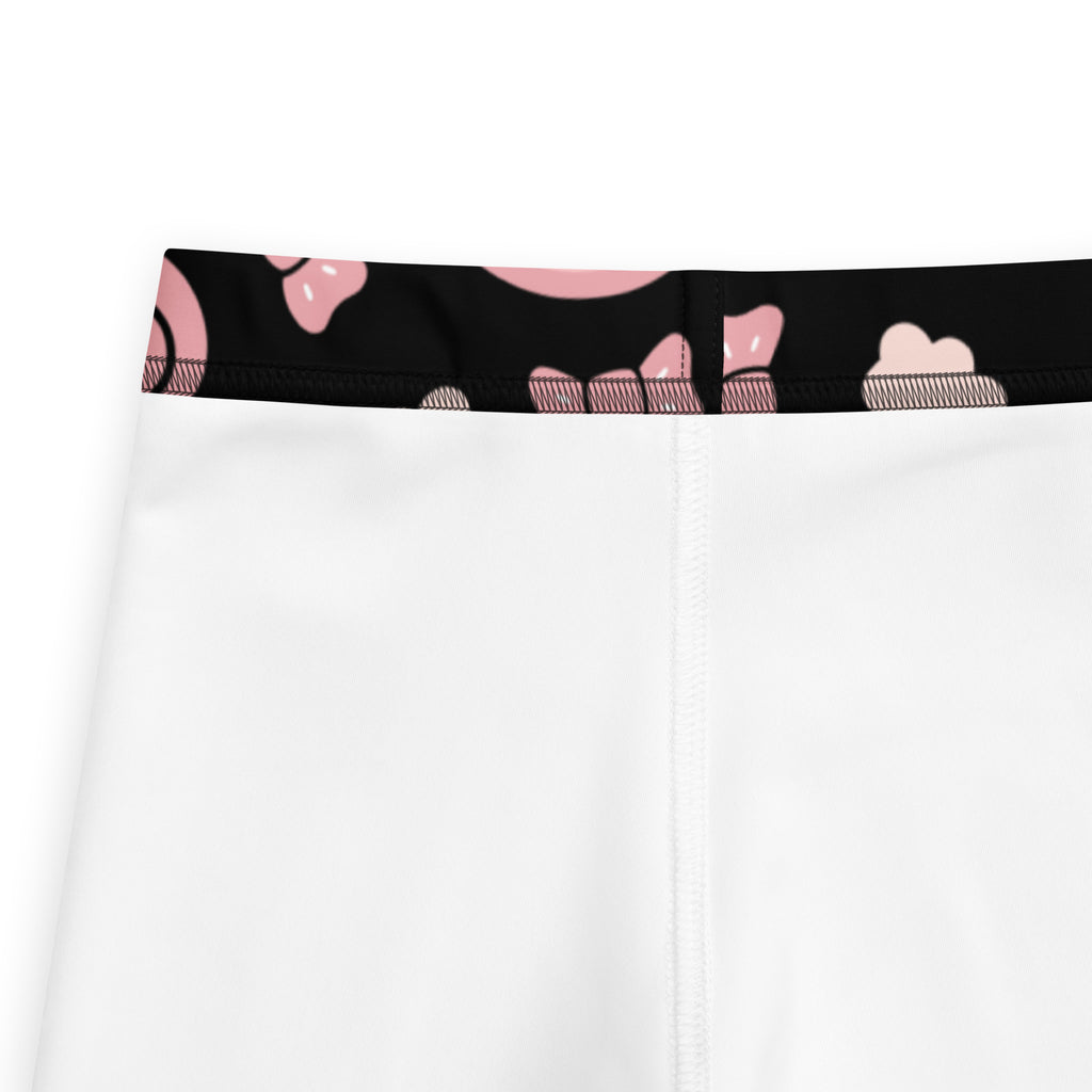 White athletic shorts with black waistband and pink cloud patterns from girls unicorn rainbow buttery soft leggings