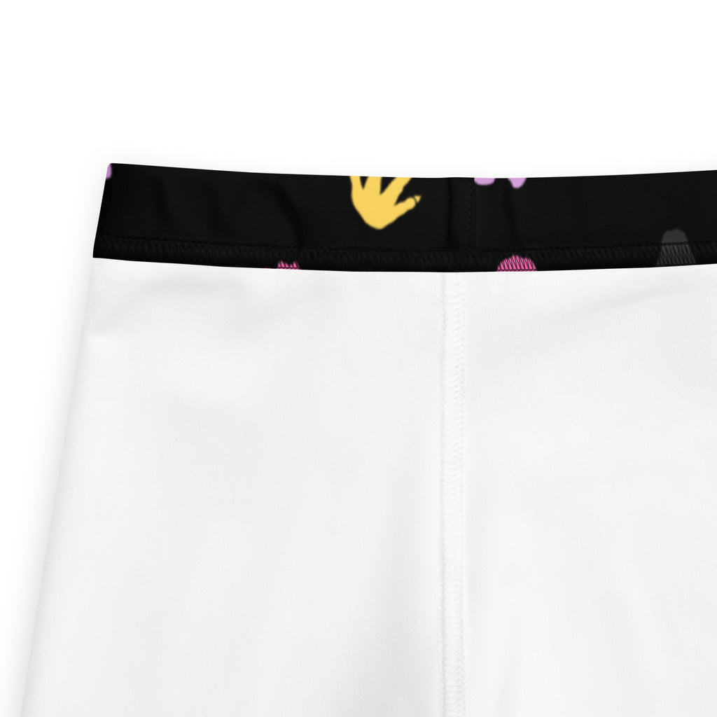 White girls dinosaur footprint buttery soft leggings with black waistband yellow handprints and pink circular patterns