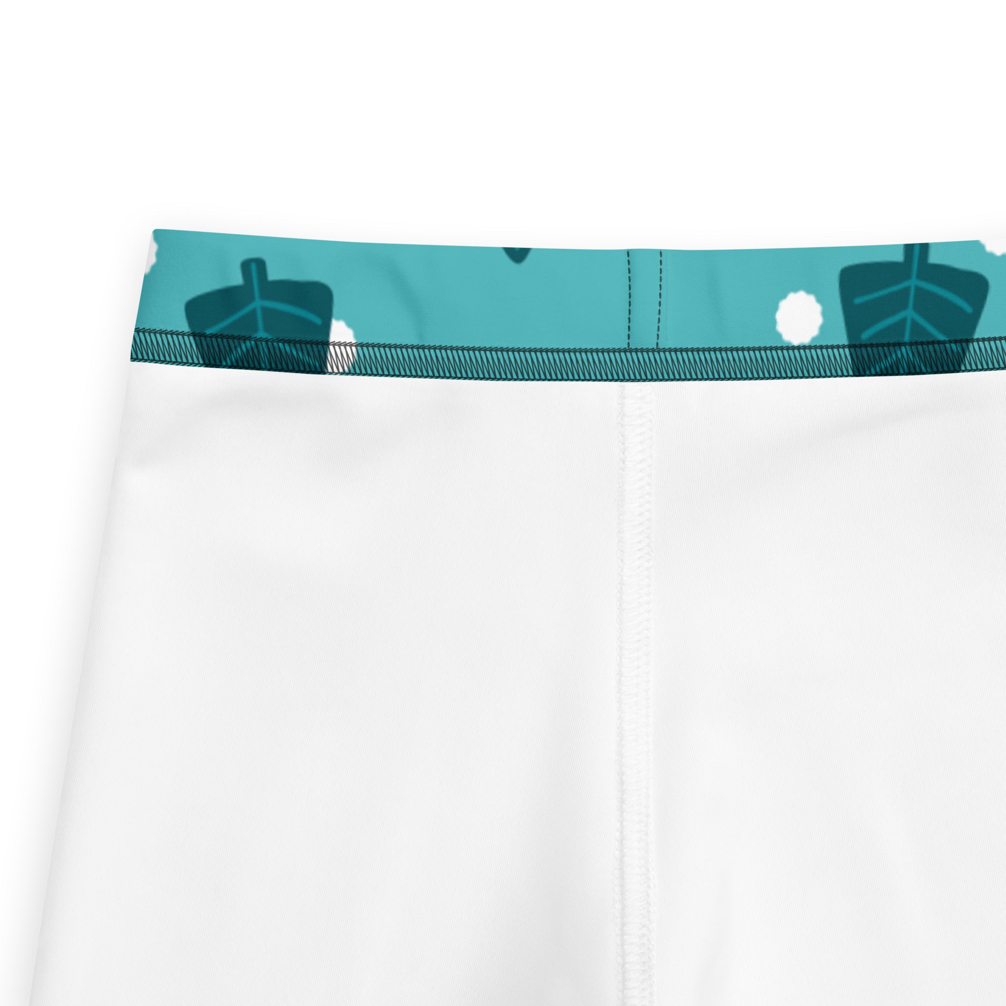 Kids christmas tree snow buttery soft leggings in white with a teal leaf pattern waistband and soft fabric