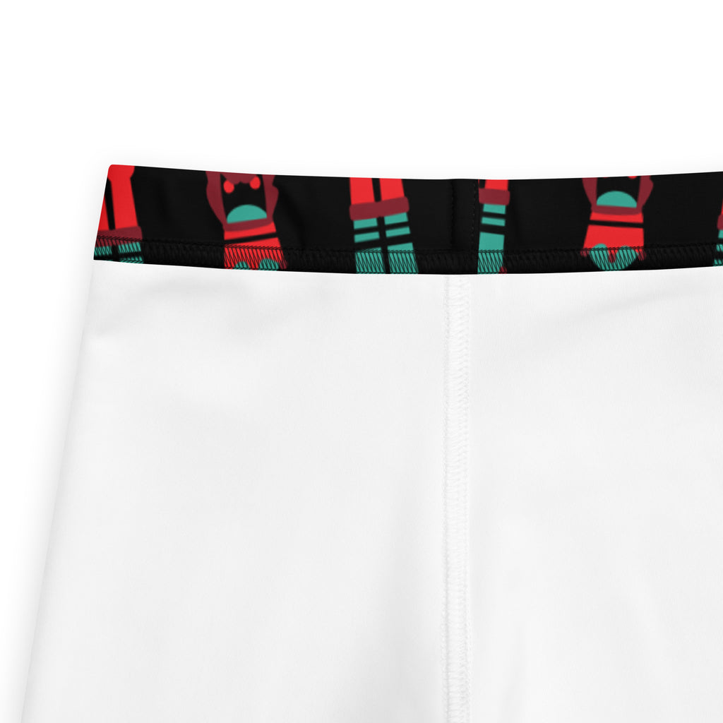 White girls nutcracker christmas buttery soft athletic shorts with black waistband and red teal figure pattern