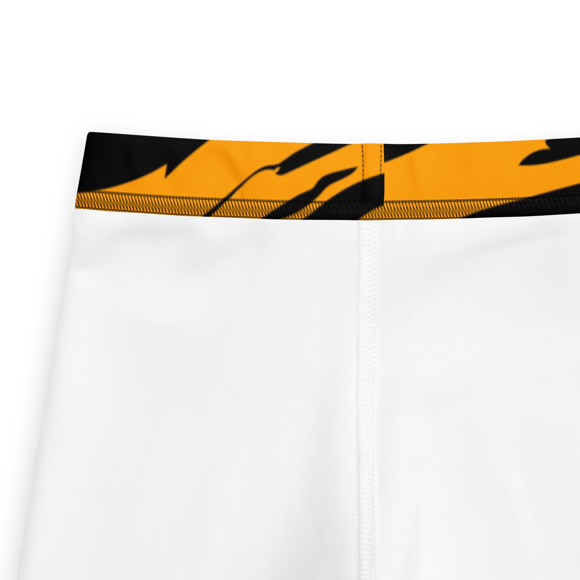 Kids tiger stripe buttery soft leggings with white athletic shorts featuring a bold black and orange tiger stripe waistband