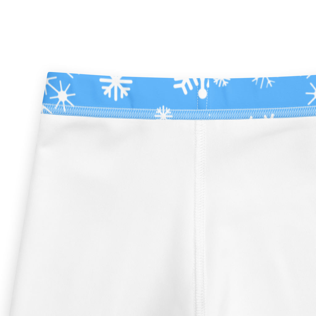 Kids blue snowflake buttery soft leggings in white with blue elastic waistband and white snowflake patterns