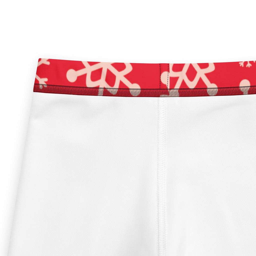 Kids red snowflake buttery soft white athletic leggings with red waistband and white abstract snowflake pattern