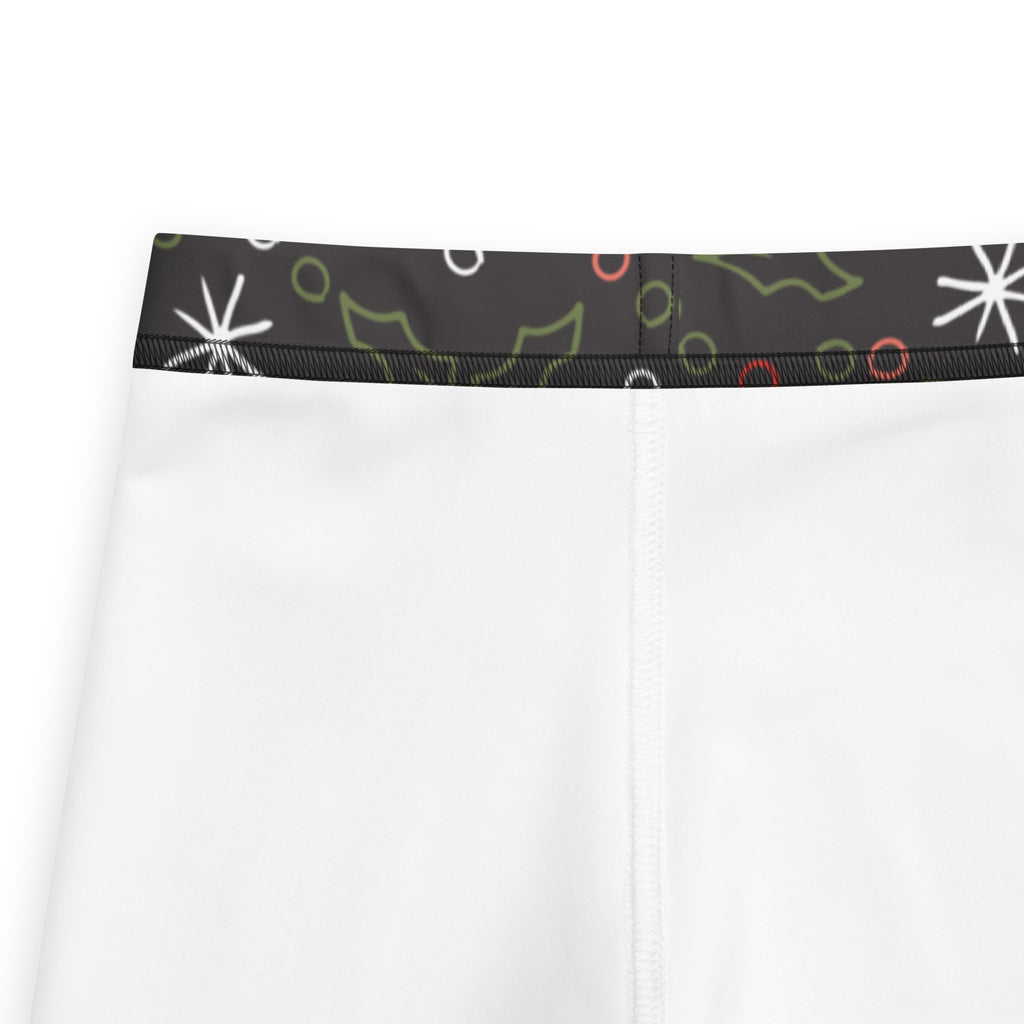 Kids christmas candy canes and holly leaves buttery soft white leggings with festive black waistband featuring starbursts and holly leaves