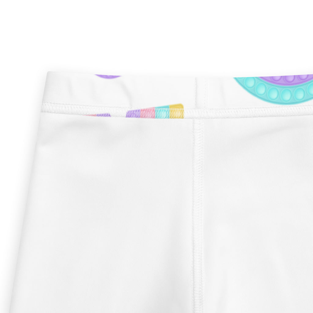 White buttery soft kids leggings with colorful pop-it bubble fidget buttons along the waistband