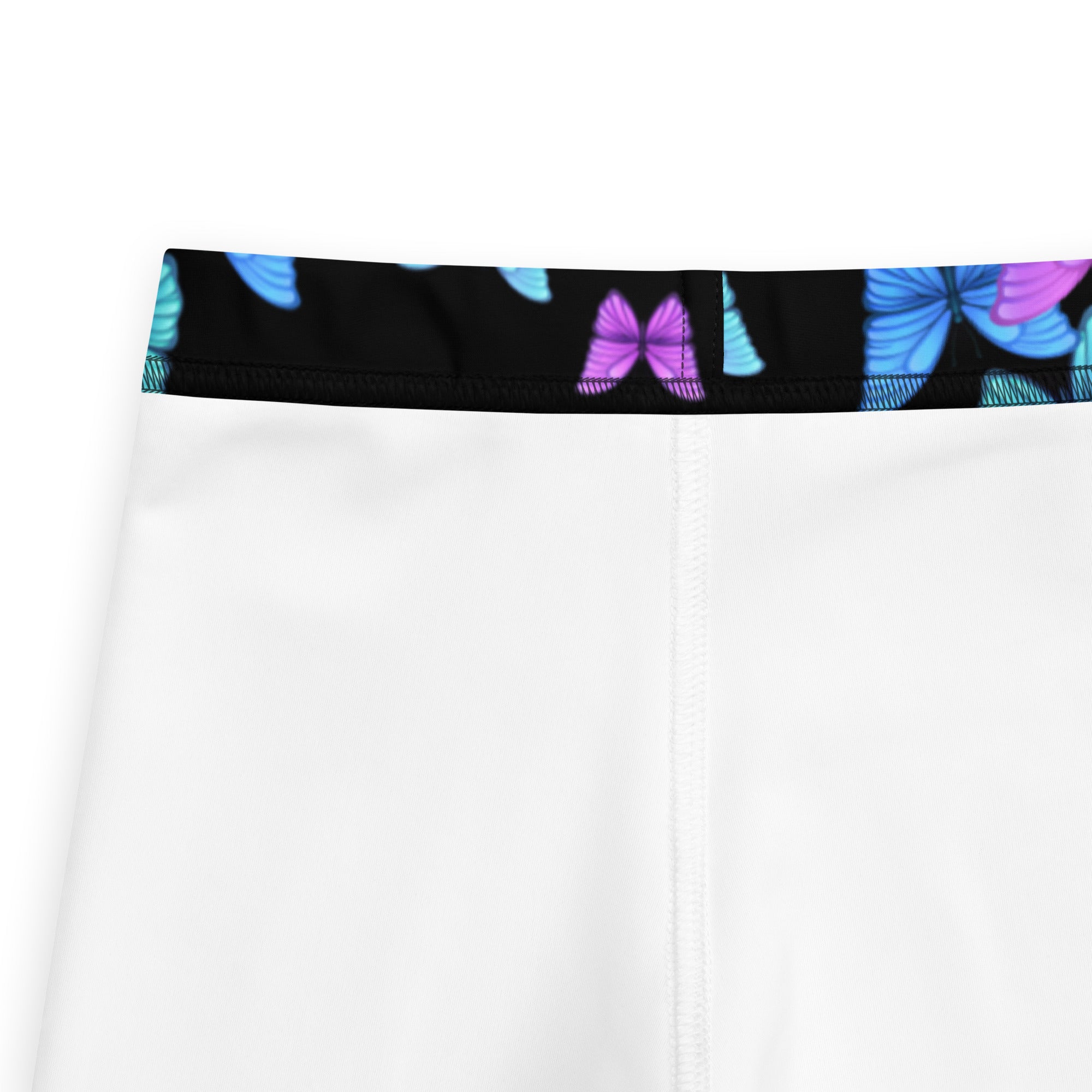 Girls vibrant butterfly buttery soft white leggings with black waistband and blue and purple butterfly prints