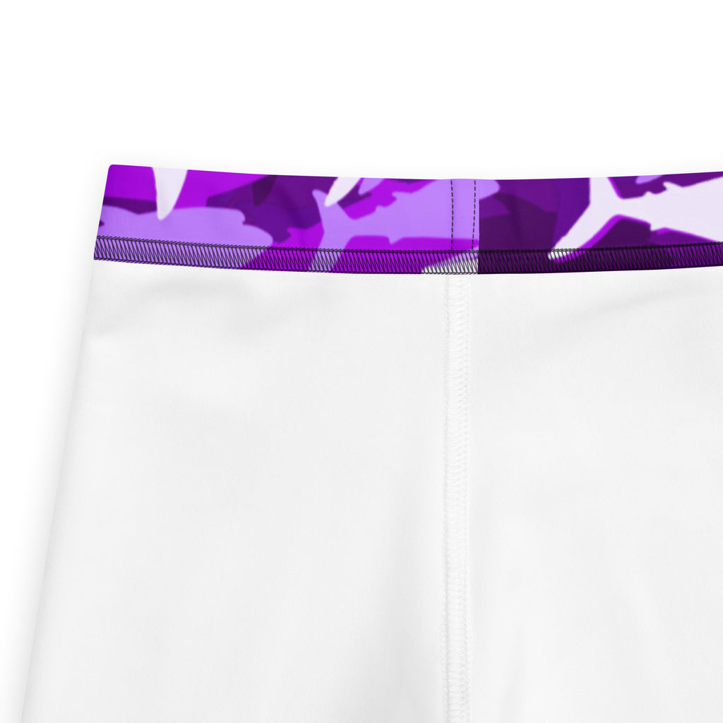 Girls purple shark buttery soft leggings showing white athletic shorts with vibrant purple and white camo waistband