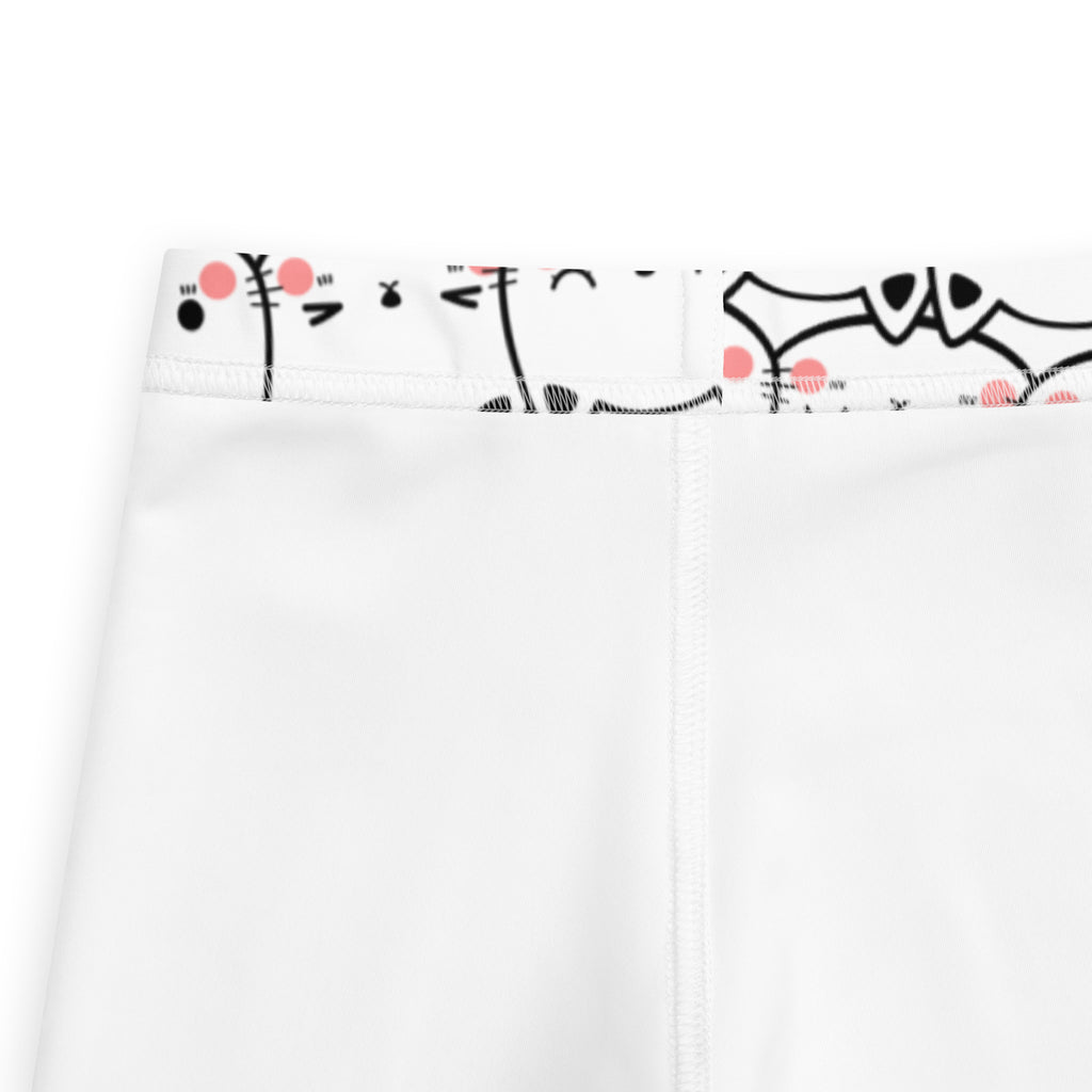 Girls white cat face buttery soft leggings with playful black and pink cartoon waistband illustrations