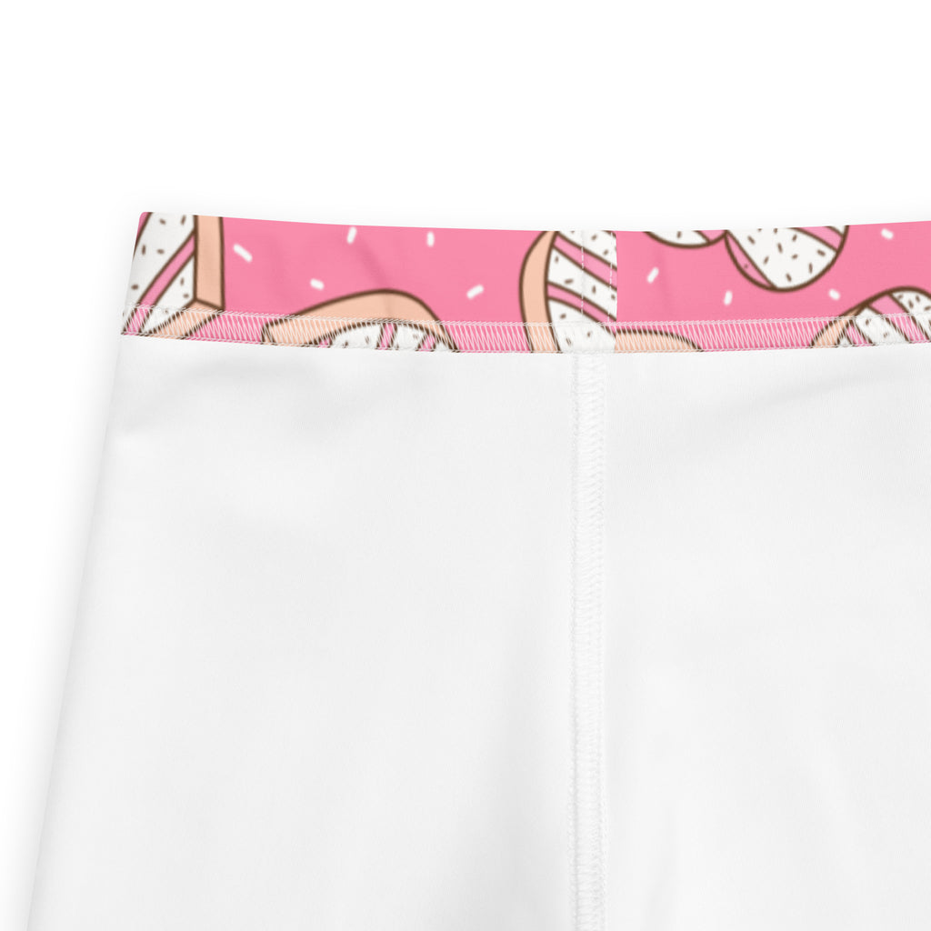 Girls pink heart cookie buttery soft white leggings with a playful pink donut sprinkle waistband