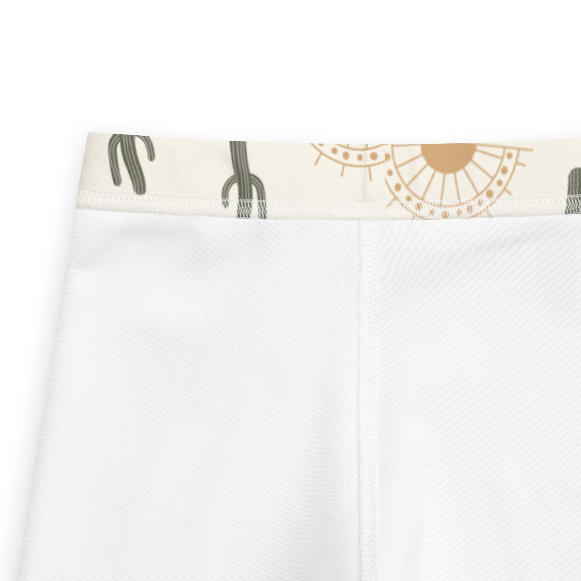 White kids cactus desert sunrise buttery soft leggings with cream waistband featuring black cactus and gold suns