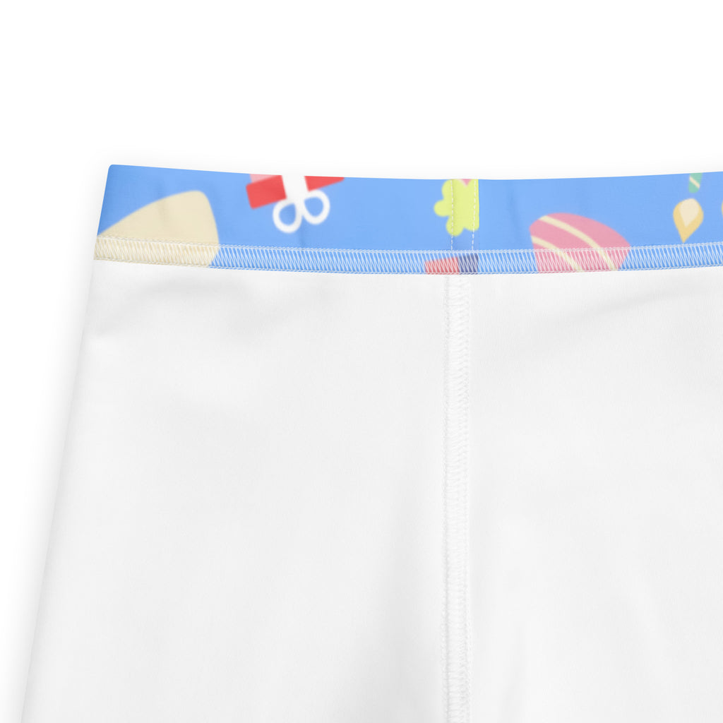 White kids athletic leggings with blue waistband and colorful birthday cartoon graphics buttery soft fabric
