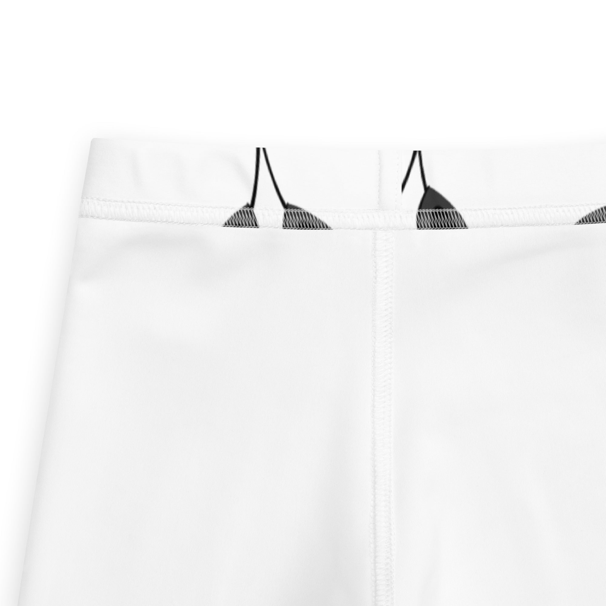 White athletic shorts with black triangular graphic print on waistband designed for kids black and white panda leggings