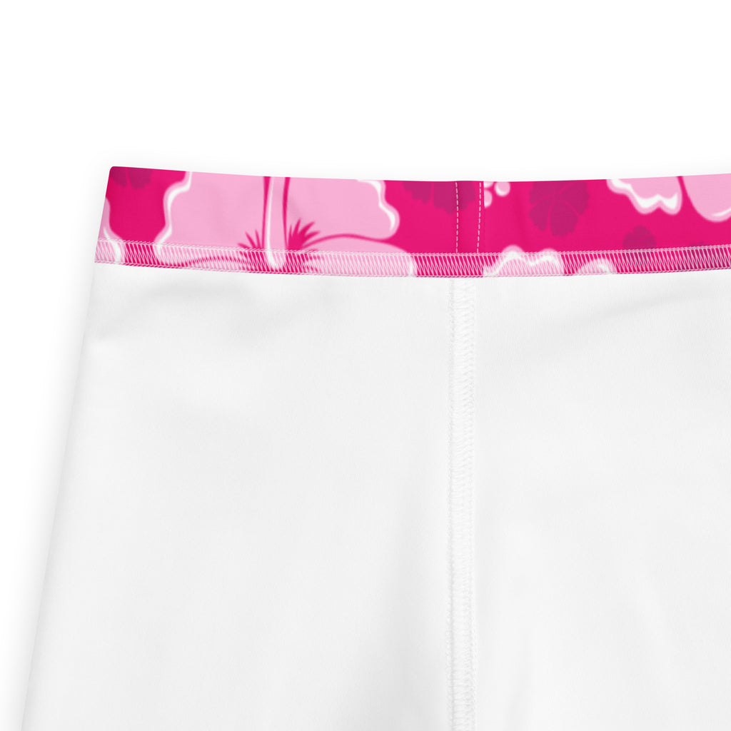 White girls leggings with a vibrant pink hibiscus floral waistband made of buttery soft fabric