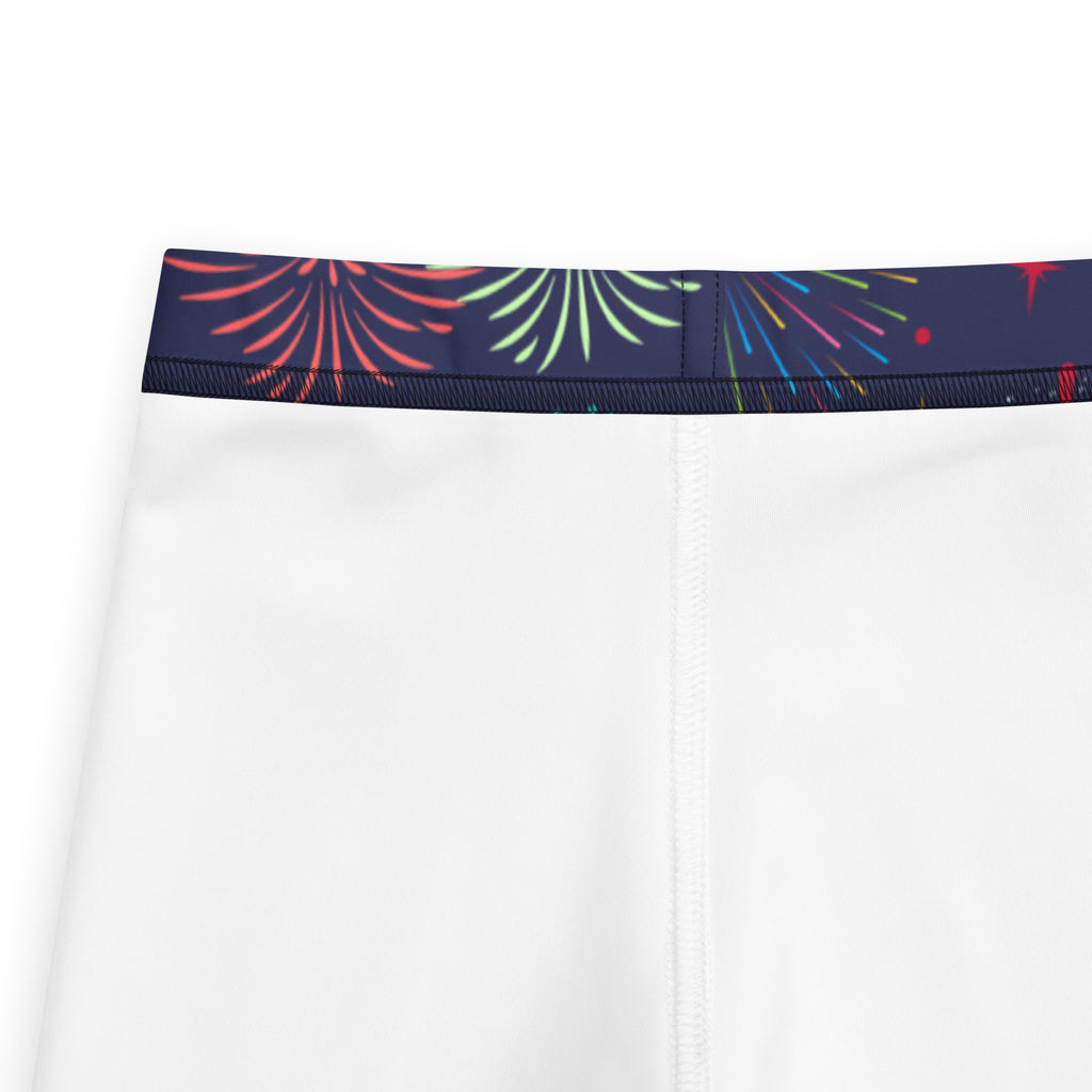 White girls athletic shorts with navy blue waistband and vibrant red green fireworks pattern in buttery soft fabric