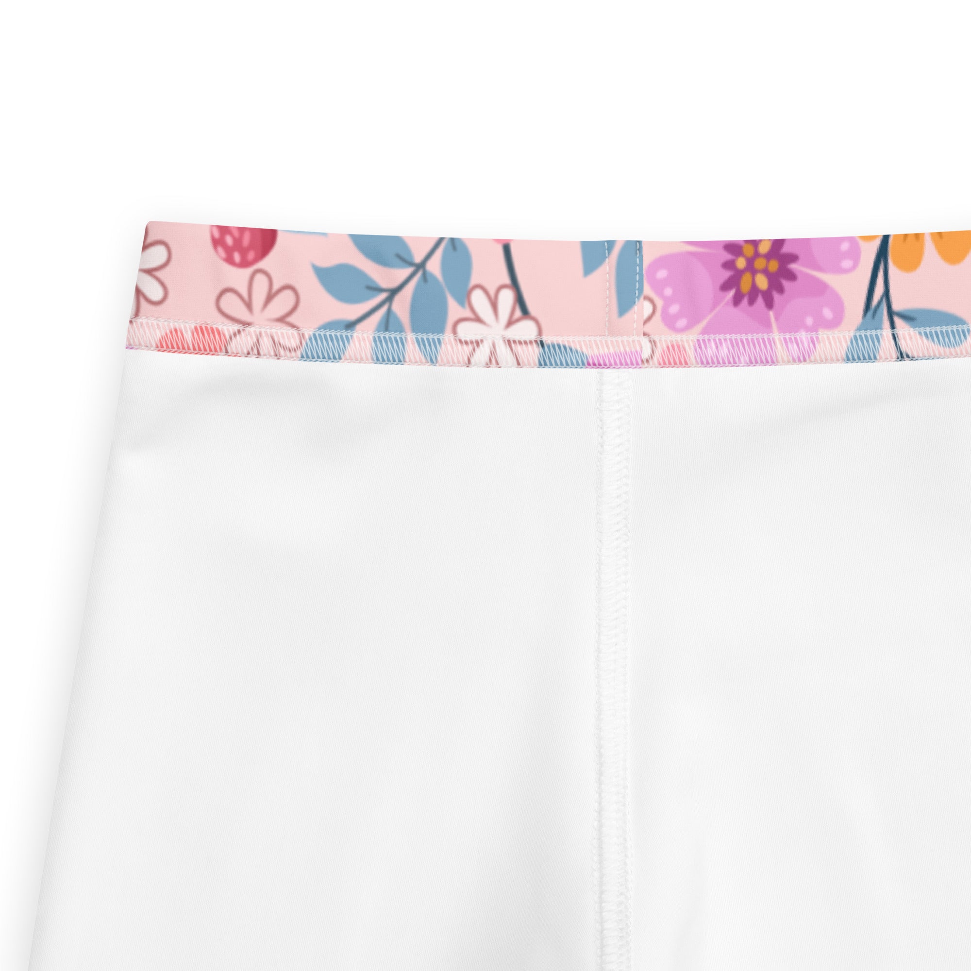 Girls pink floral buttery soft leggings in white with a colorful pink purple and blue floral waistband