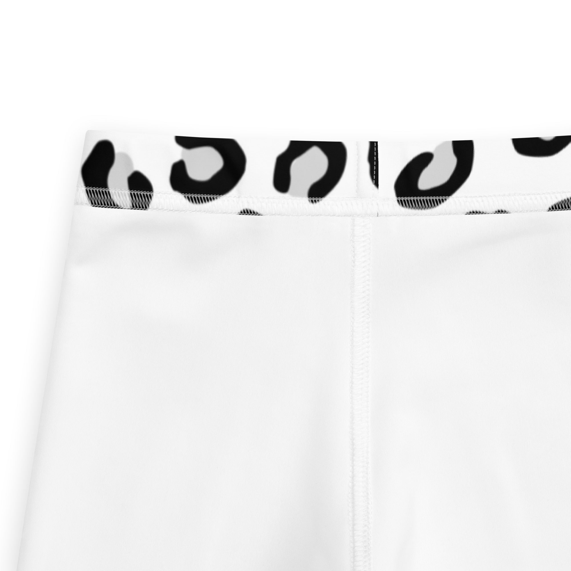Girls black and white leopard print buttery soft leggings with white fabric and a black and gray leopard print waistband