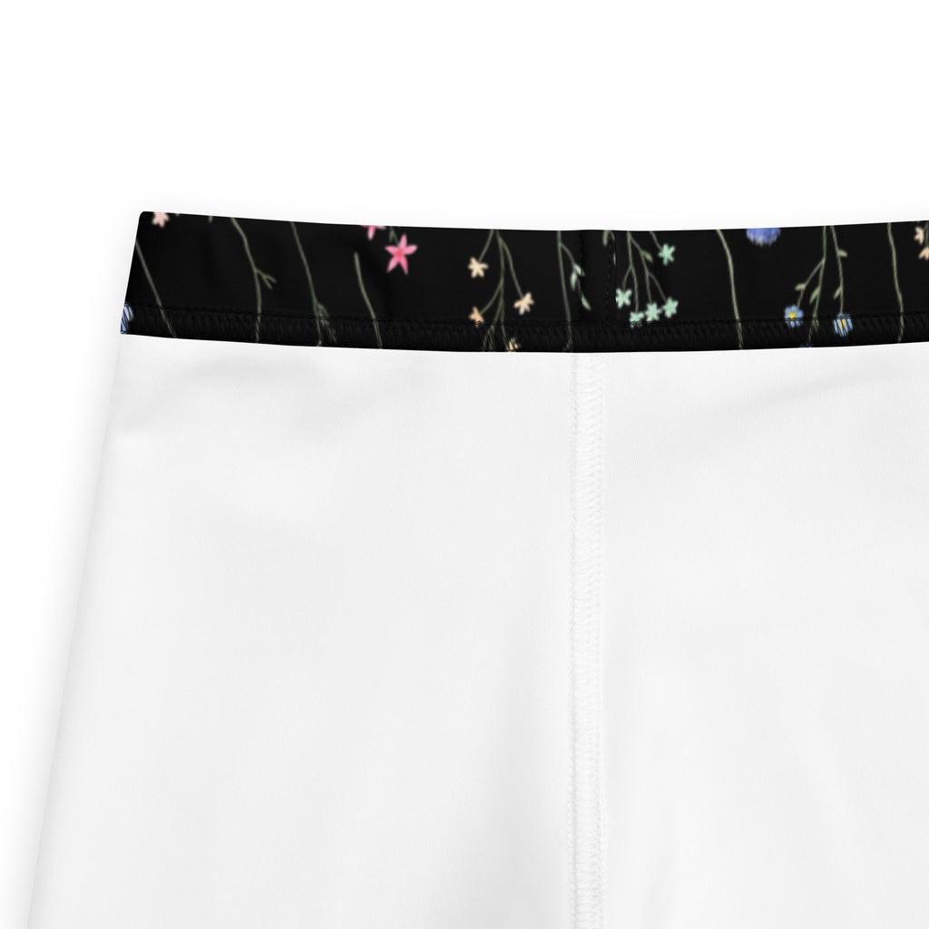 Girls black wildflower buttery soft leggings in white shorts with black waistband and pink white light blue floral pattern