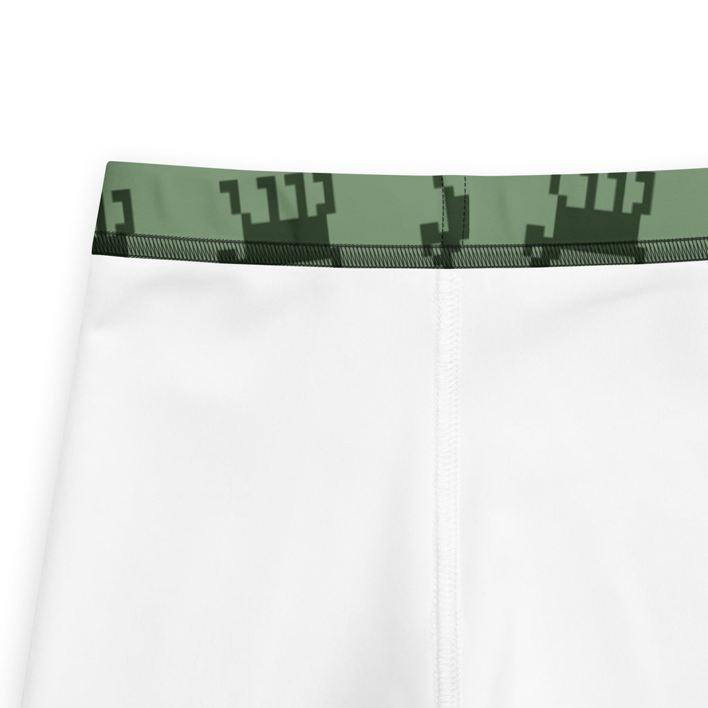 White athletic shorts with green pixelated crown waistband detail for kids buttery soft christmas leggings