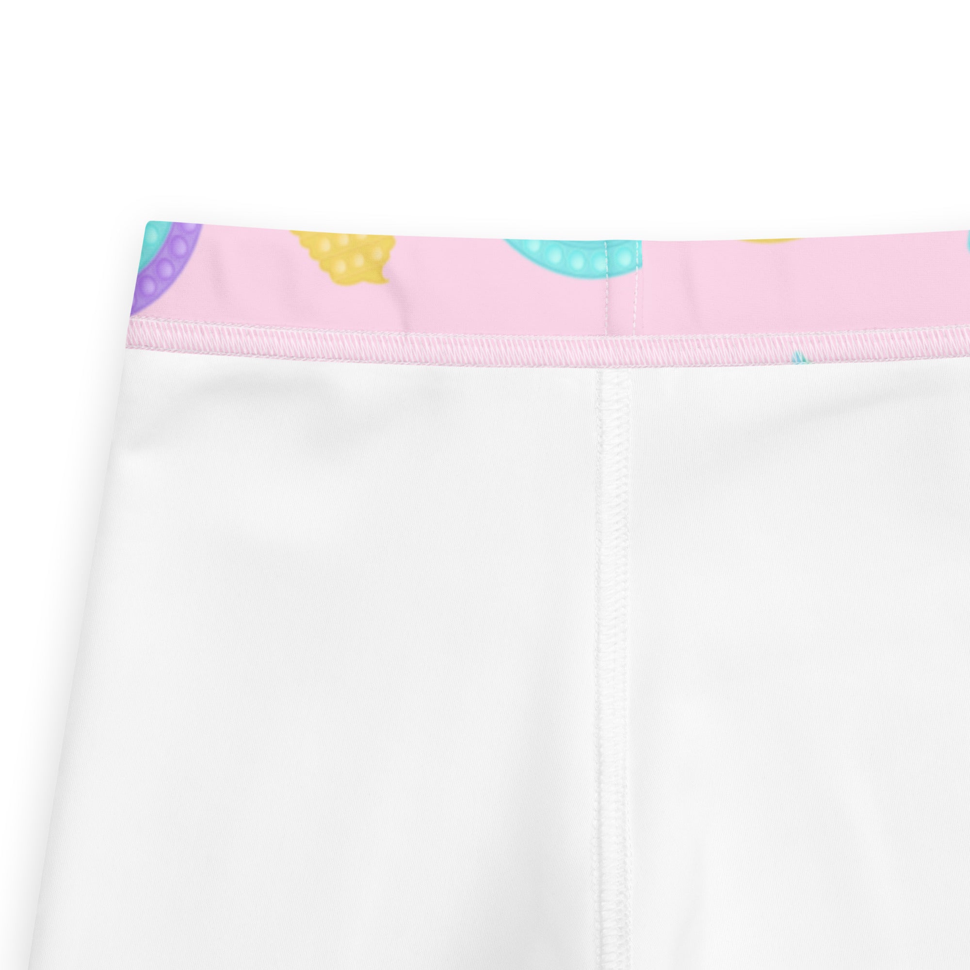 Girls fidget toy themed white leggings with a pink waistband and colorful polka-dotted donut patterns in buttery soft fabric