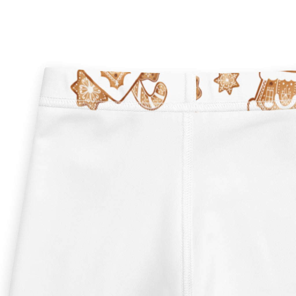 White high-waisted kids leggings with buttery soft fabric and gold toned decorative pattern on the waistband