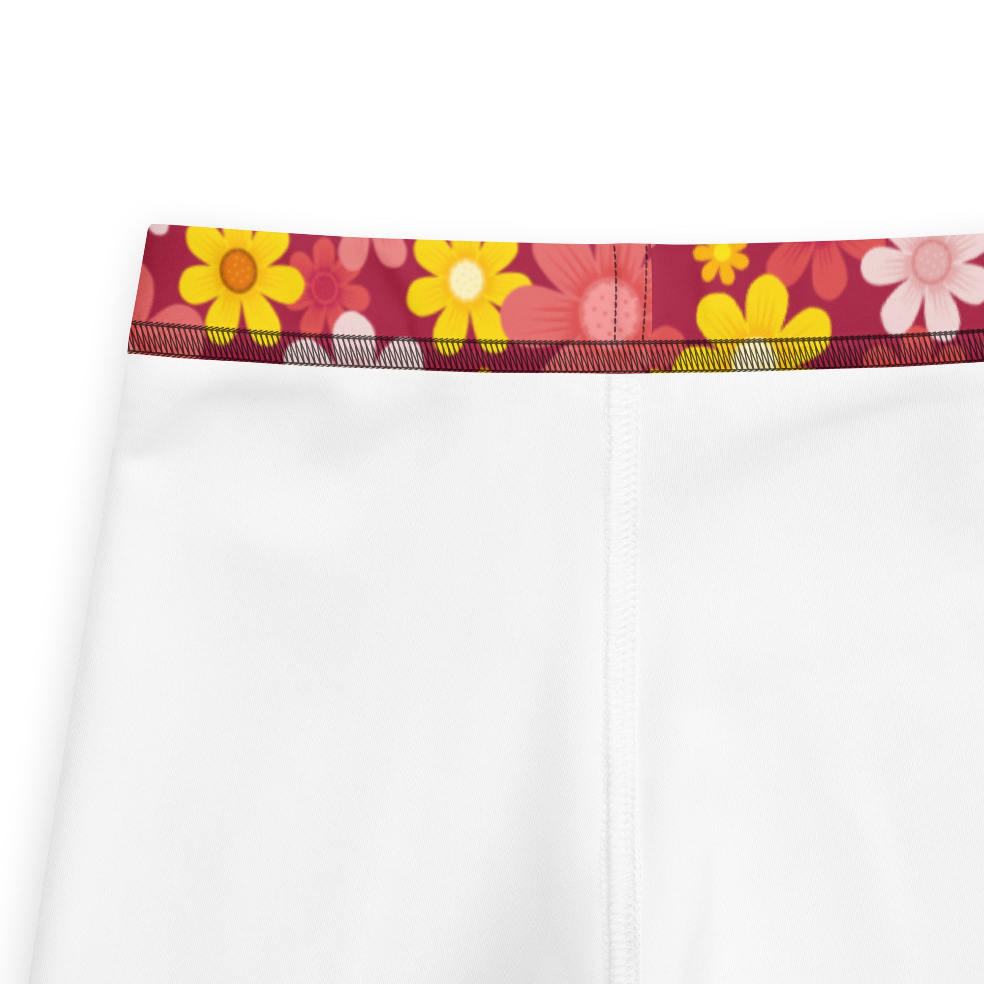Girls red floral buttery soft leggings with white shorts and a vibrant floral waistband in yellow pink and orange
