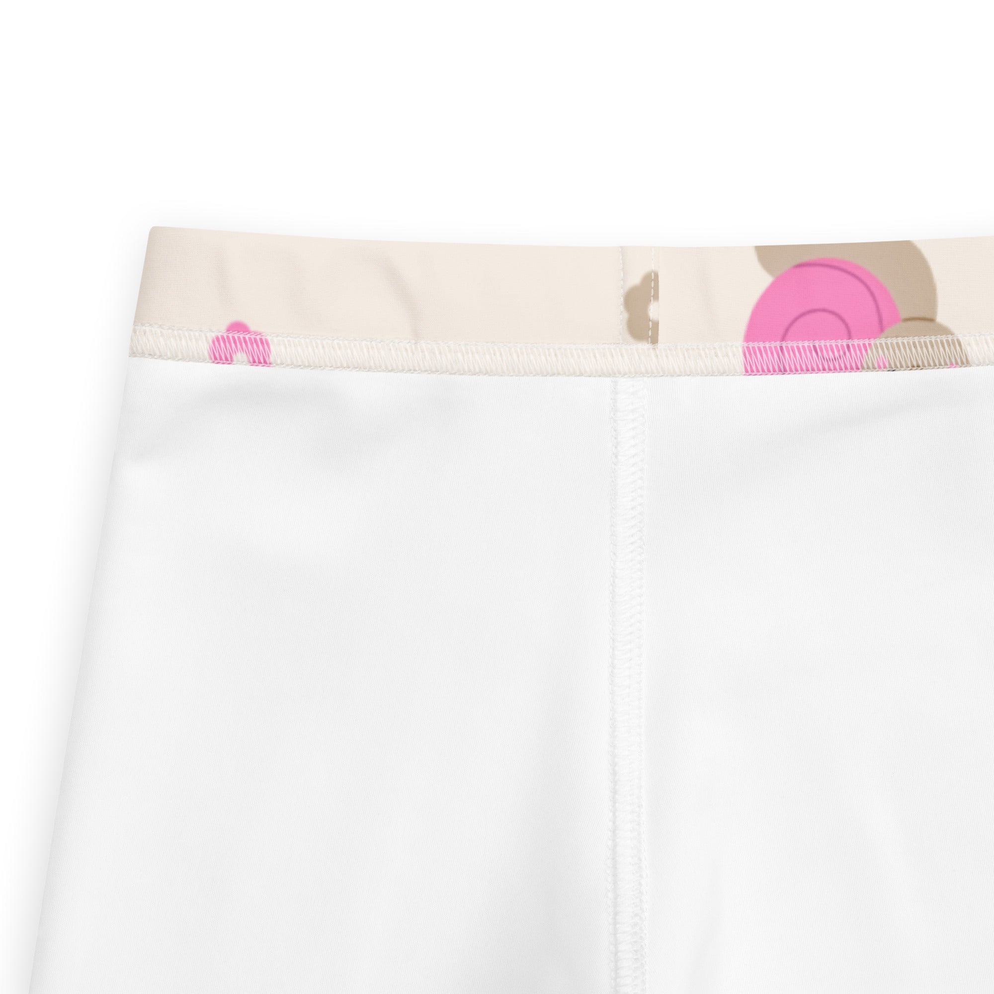 Girls pink snail buttery soft white leggings with beige waistband and pink tan circular patterns front view