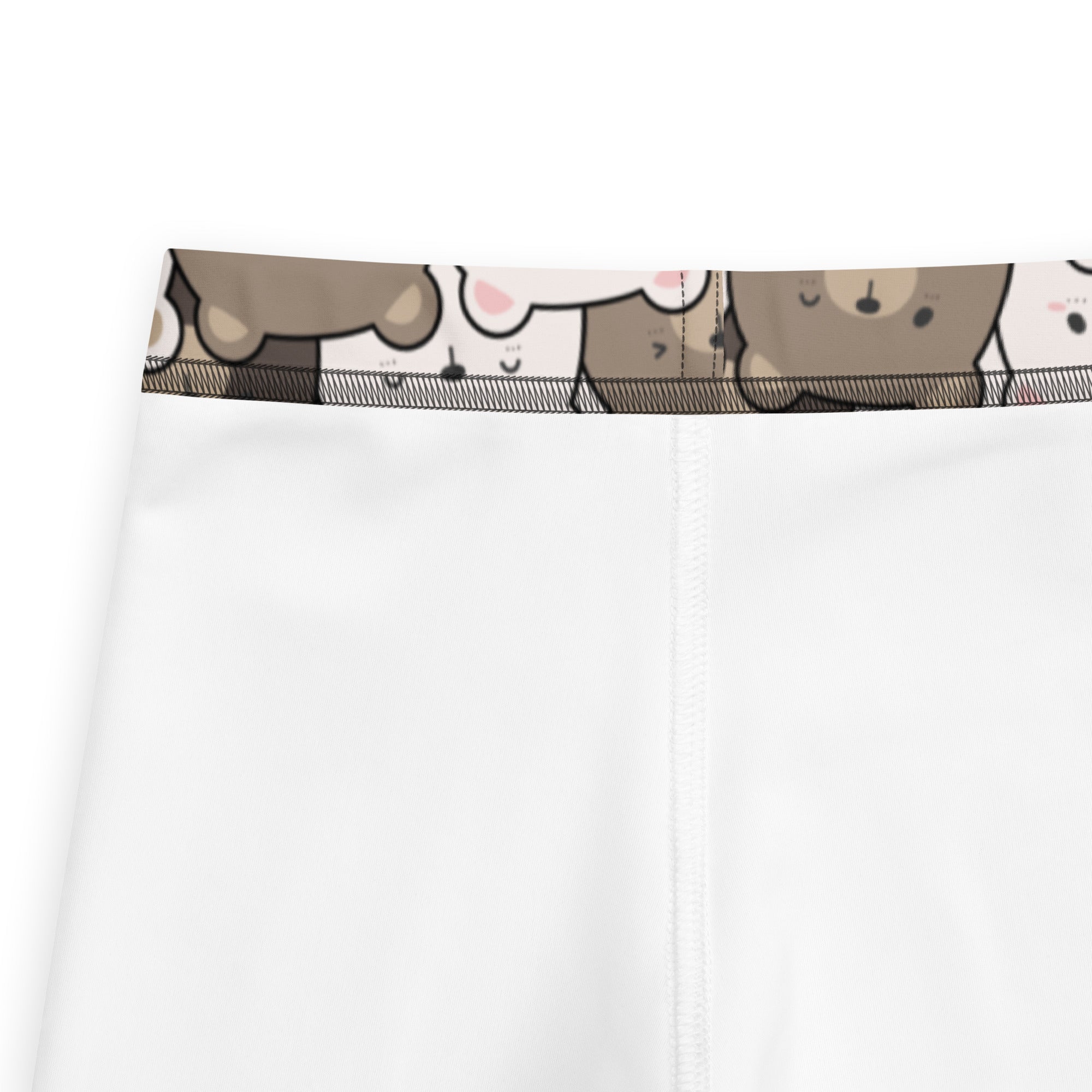 White buttery soft kids leggings with playful brown bear cartoon pattern on the waistband
