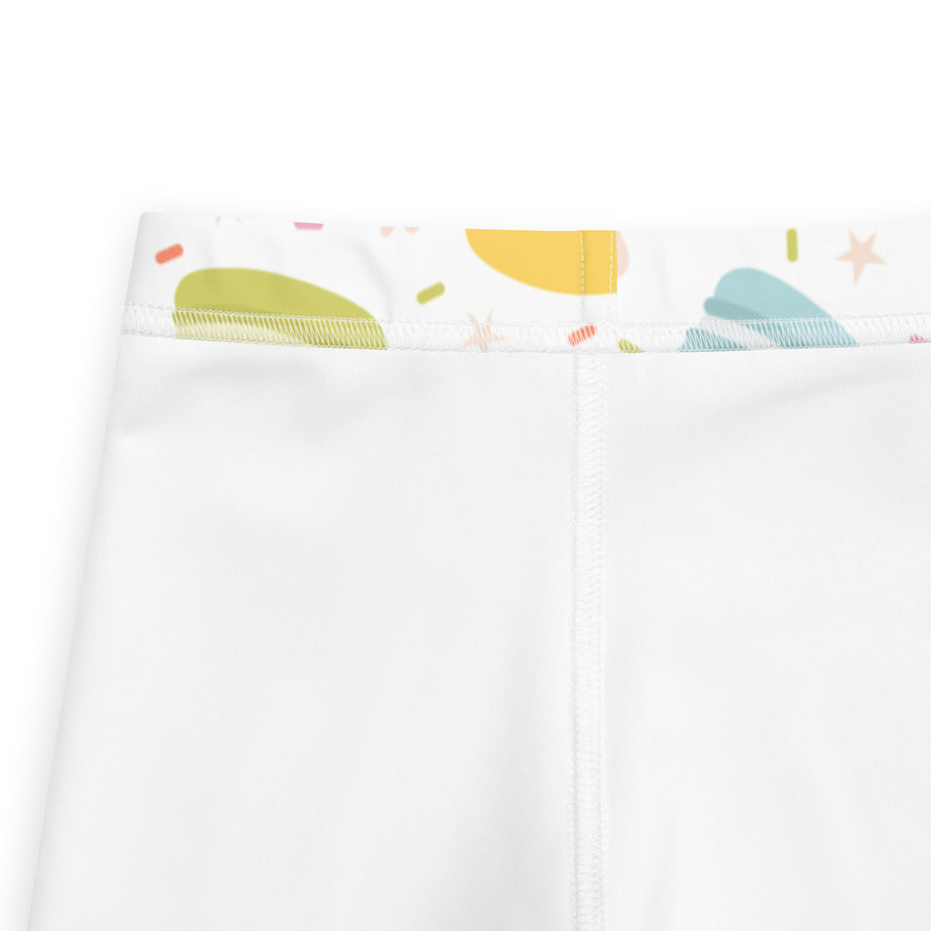 White girls macaron cookie print buttery soft leggings with colorful abstract waistband in green yellow and teal shapes