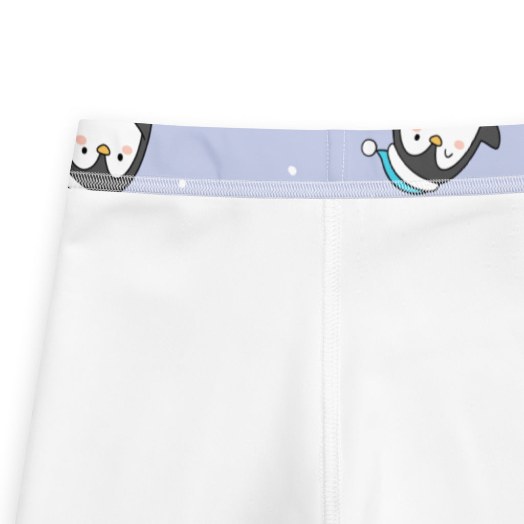 White girls winter penguin christmas buttery soft leggings with light purple waistband and cute cartoon penguin designs