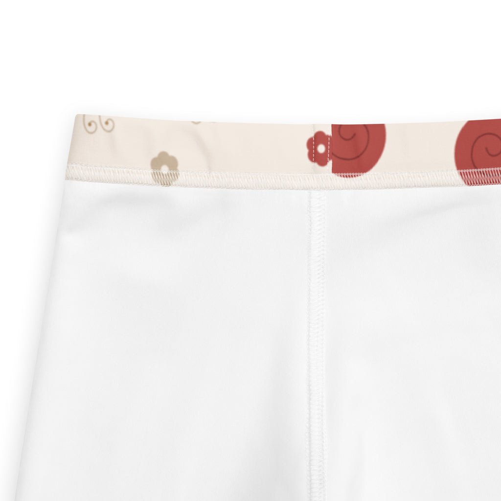 Girls red snail buttery soft white leggings with a decorative red and beige spiral pattern waistband