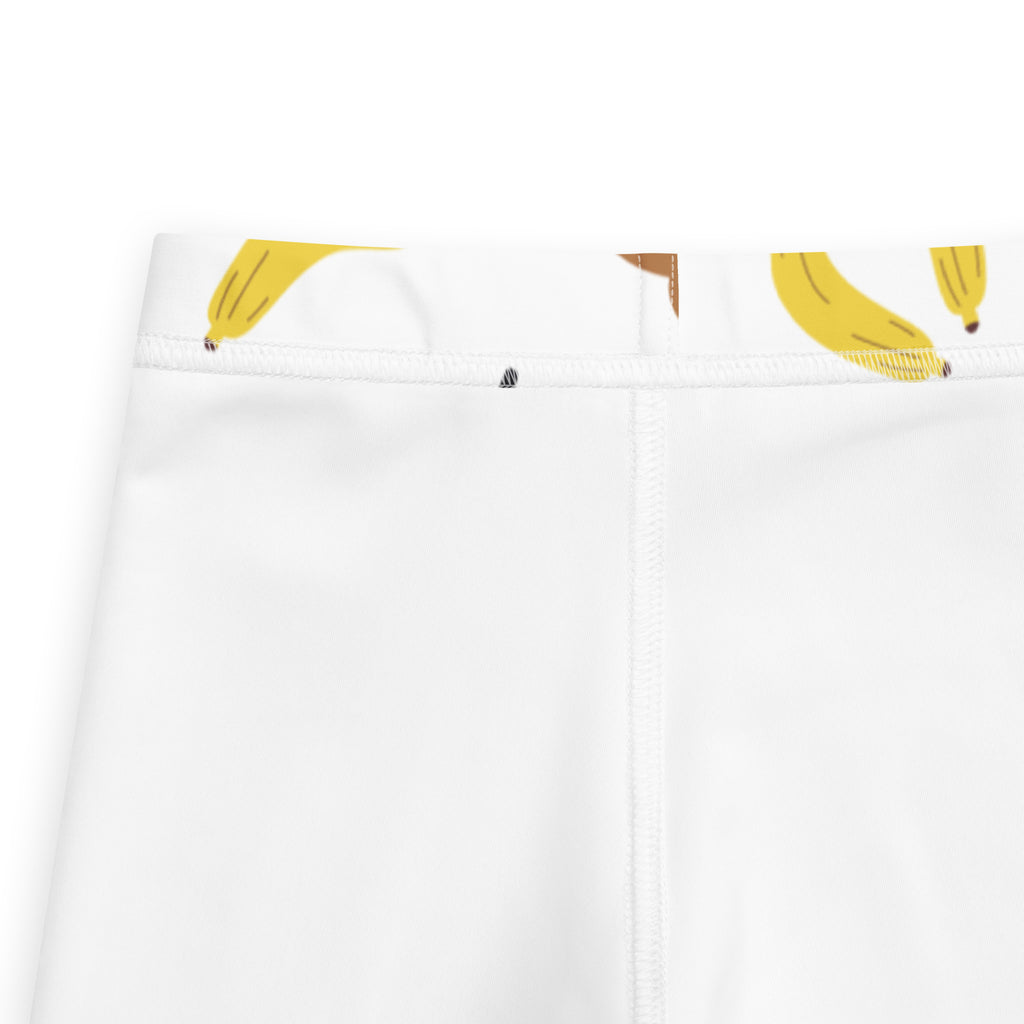 White buttery soft kids leggings with playful yellow banana print on the waistband from monkey banana collection
