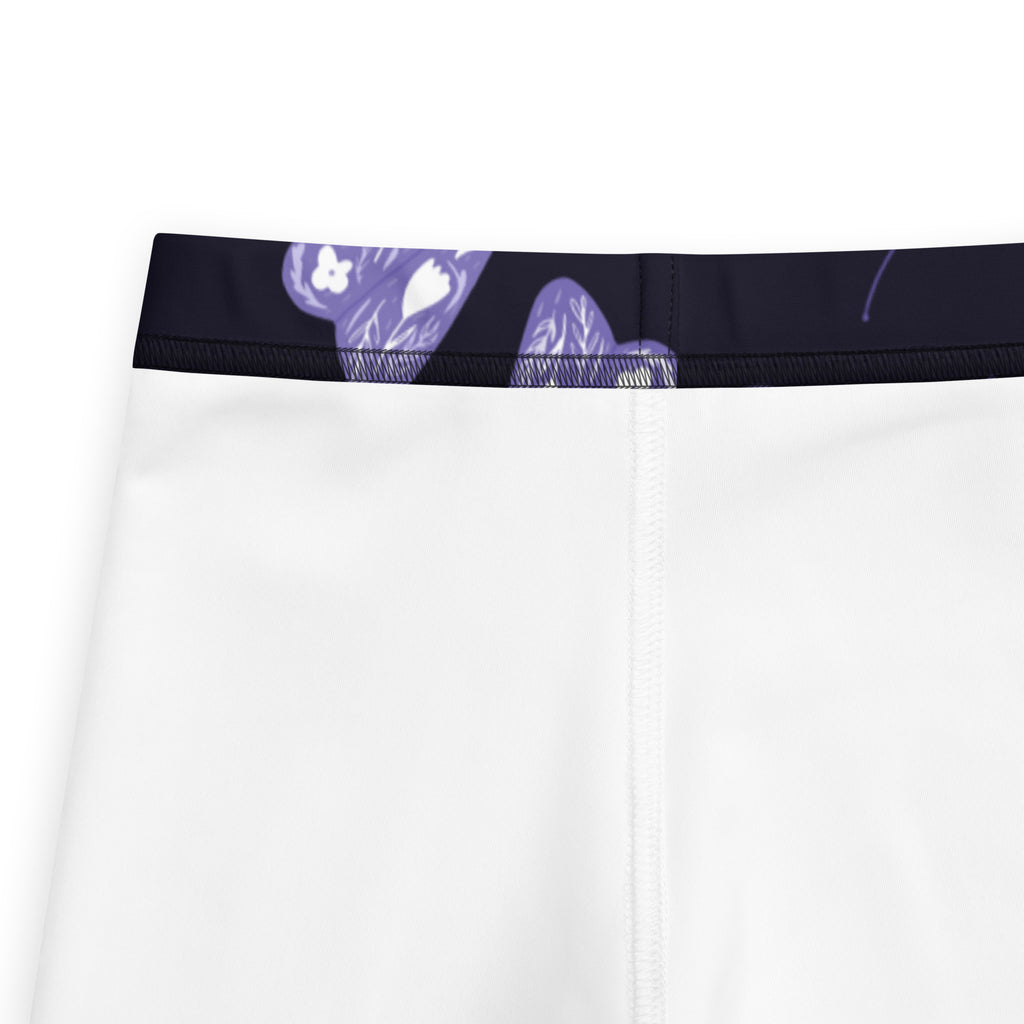 Girls purple moth buttery soft leggings shown with white athletic shorts featuring a black waistband and purple bear design