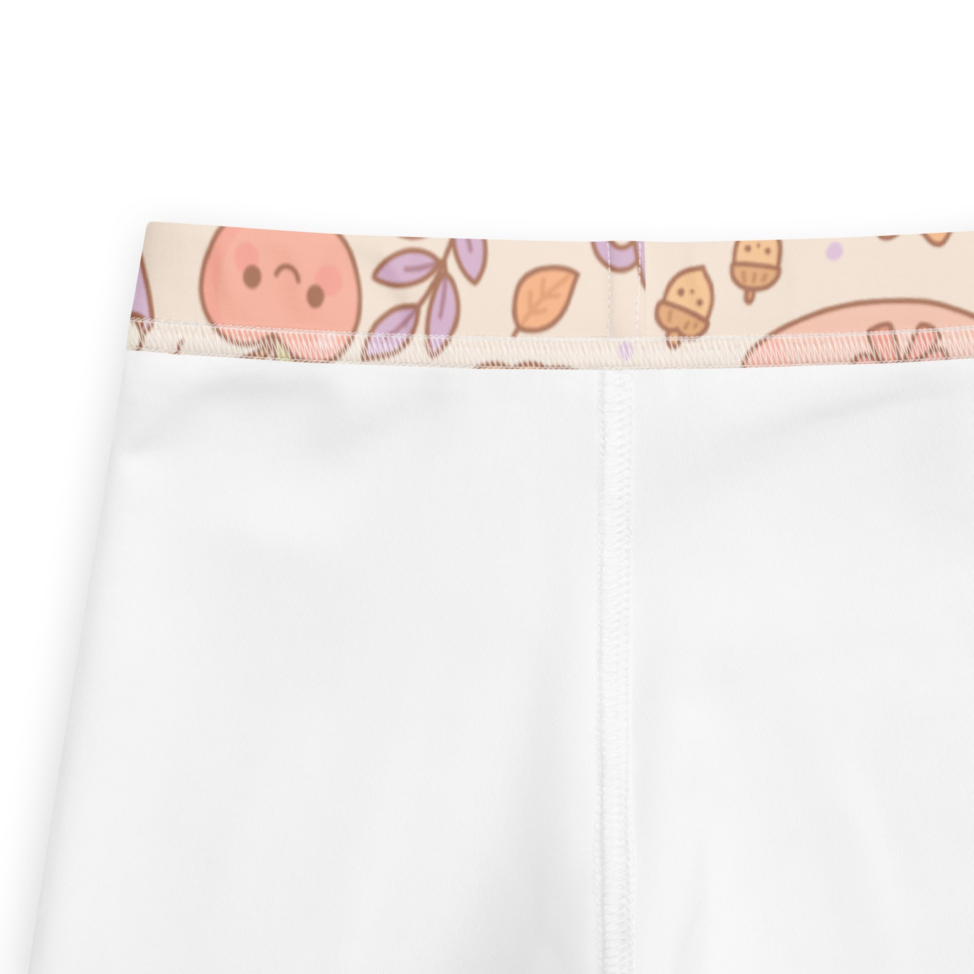 Kids cute fall themed buttery soft white leggings with pastel peach faces and autumn leaves on waistband