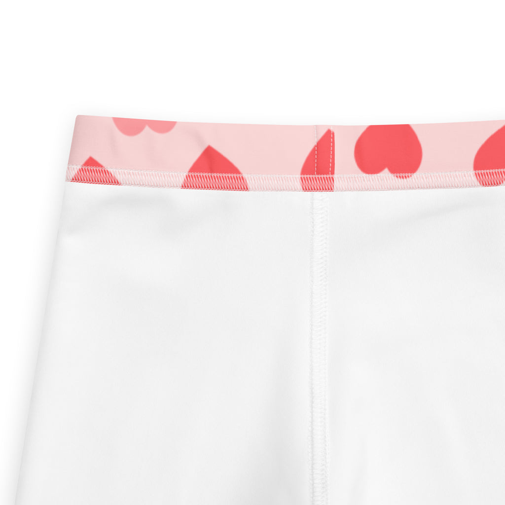 Girls blush heart buttery soft leggings in white with a pink waistband and red heart patterns