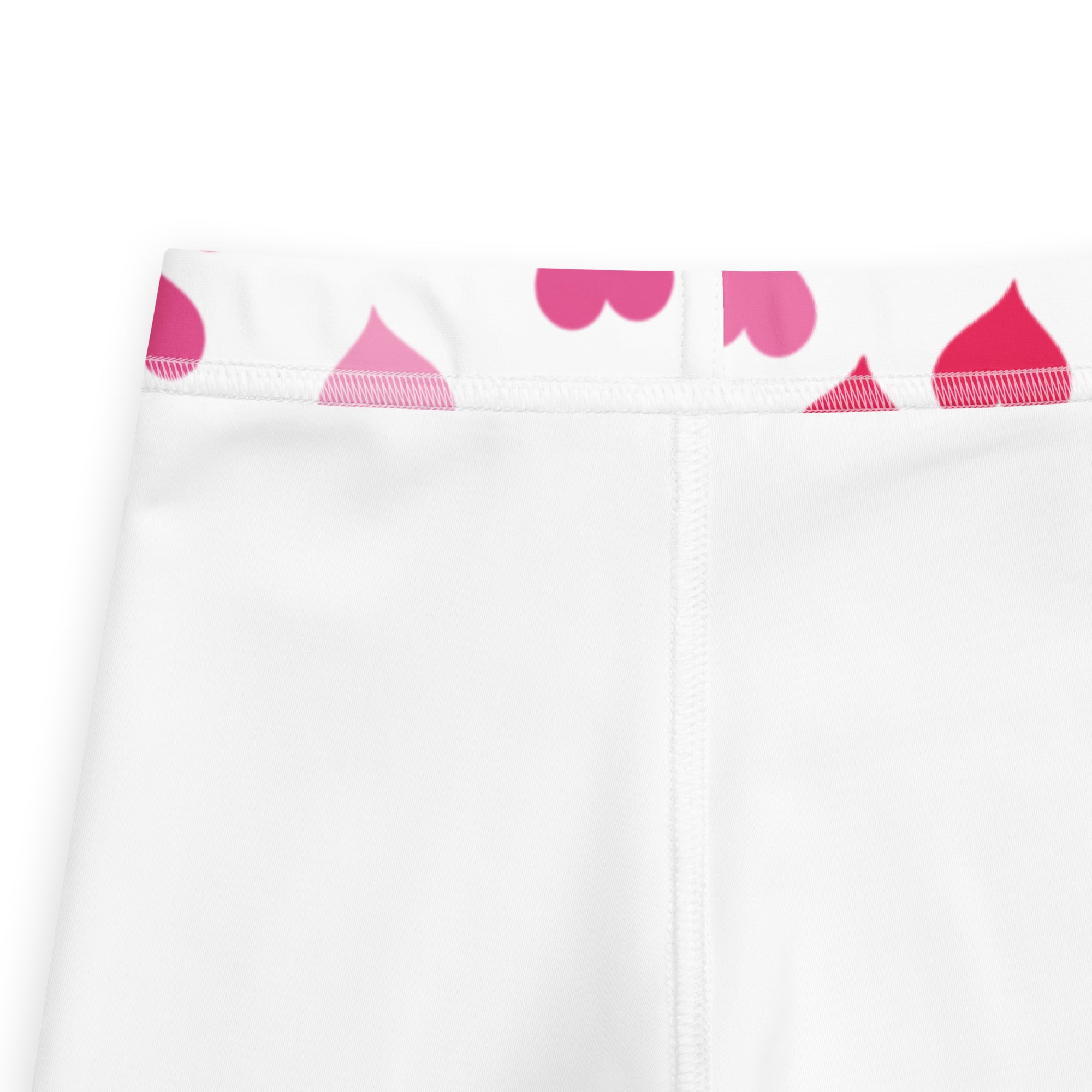Girls Valentine’s Day white buttery soft leggings with pink heart shaped teardrops pattern along the waistband