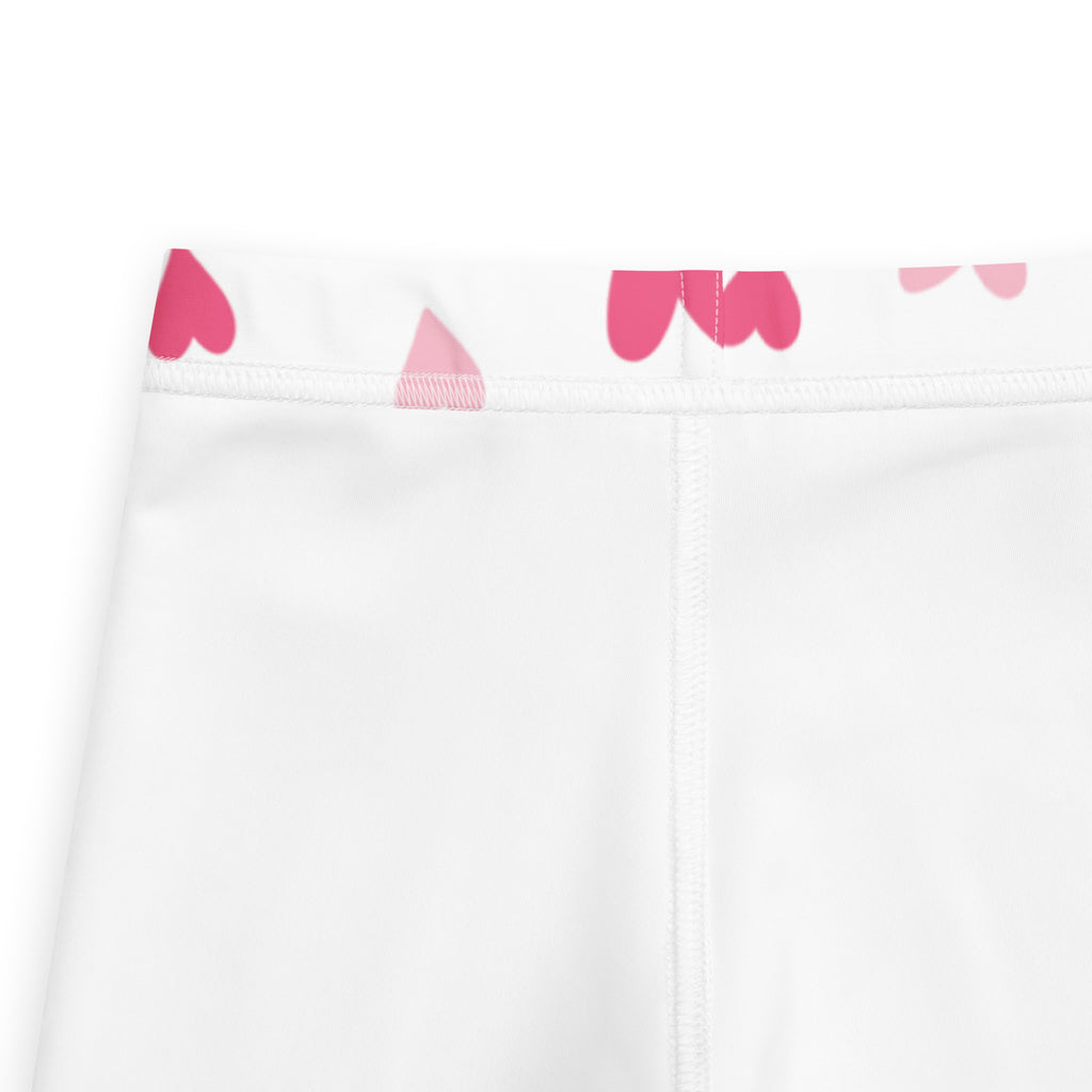 White girls leggings with pink heart and triangle pattern on waistband buttery soft fabric for valentine’s day